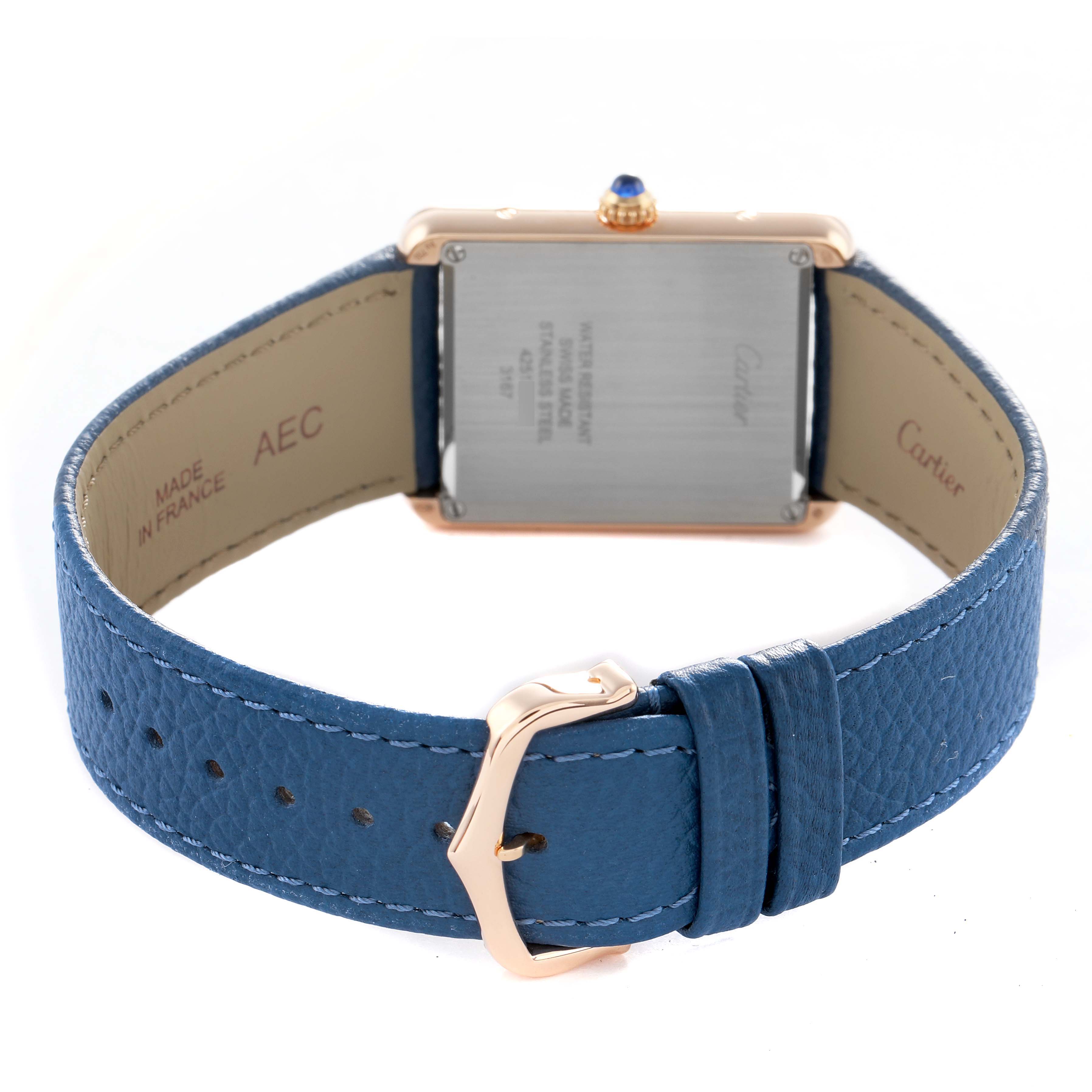 The Cartier Tank Solo W5200025 Men's Steel and Gold (two tone) Silver Dial watch is shown from the back, highlighting the case back, crown, and blue leather strap with buckle.