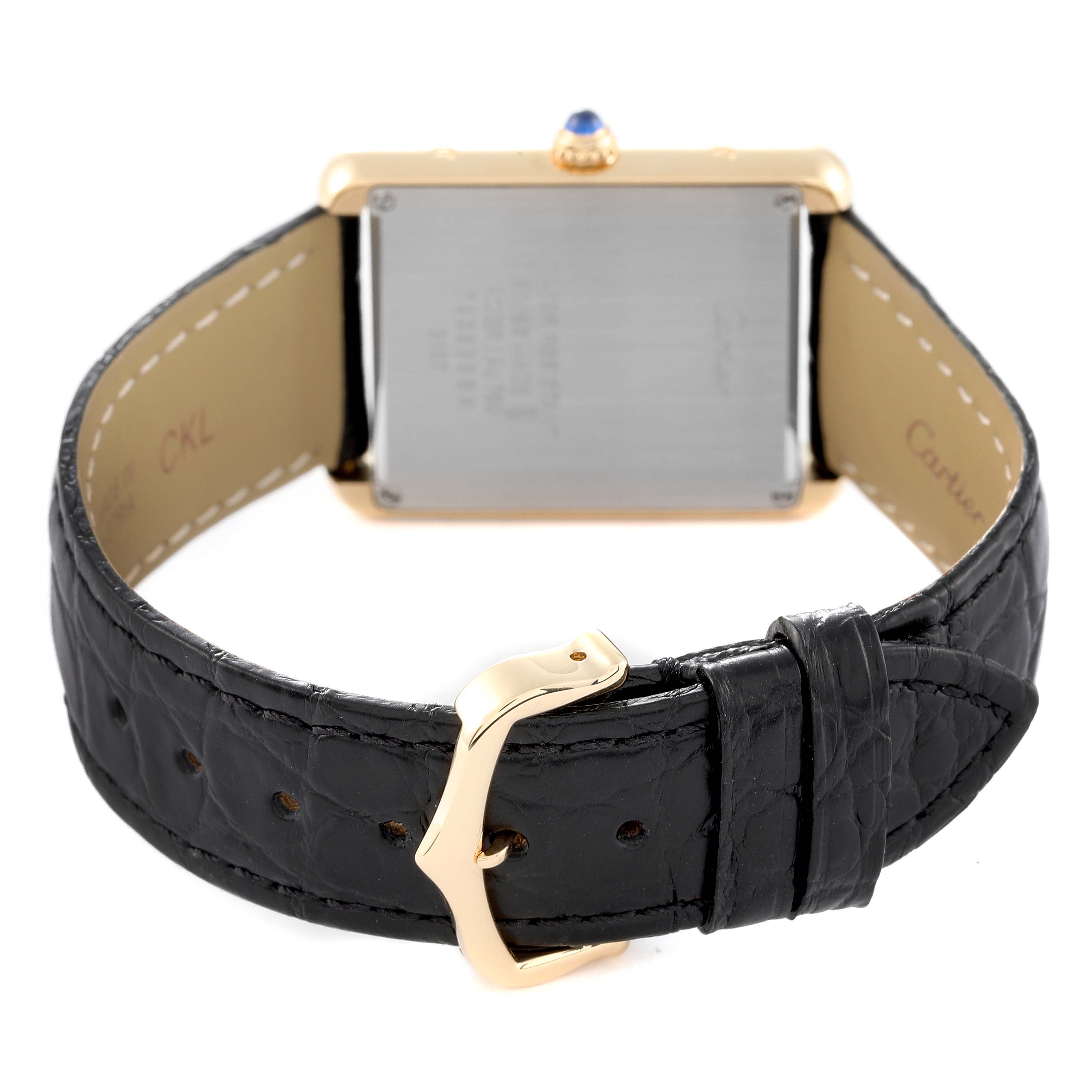 The image shows the back of a Cartier Tank Solo W5200004 Men
s Steel and Gold (two tone) Silver Dial W5200004 Men
s Steel and Gold (two tone) Silver Dial watch, highlighting the black leather strap and gold clasp.