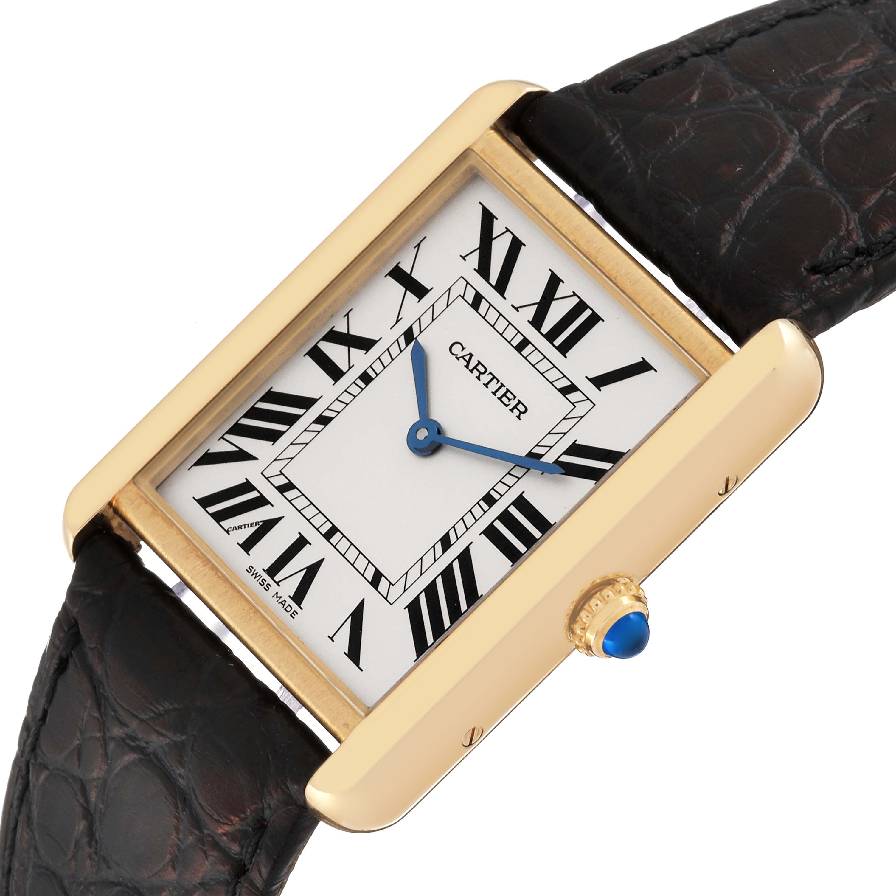 The Cartier Tank Solo W5200004 Men
s Steel and Gold (two tone) Silver Dial W5200004 Men
s Steel and Gold (two tone) Silver Dial watch is shown at a slight angle, displaying its face, gold casing, leather strap, and blue cabochon crown.