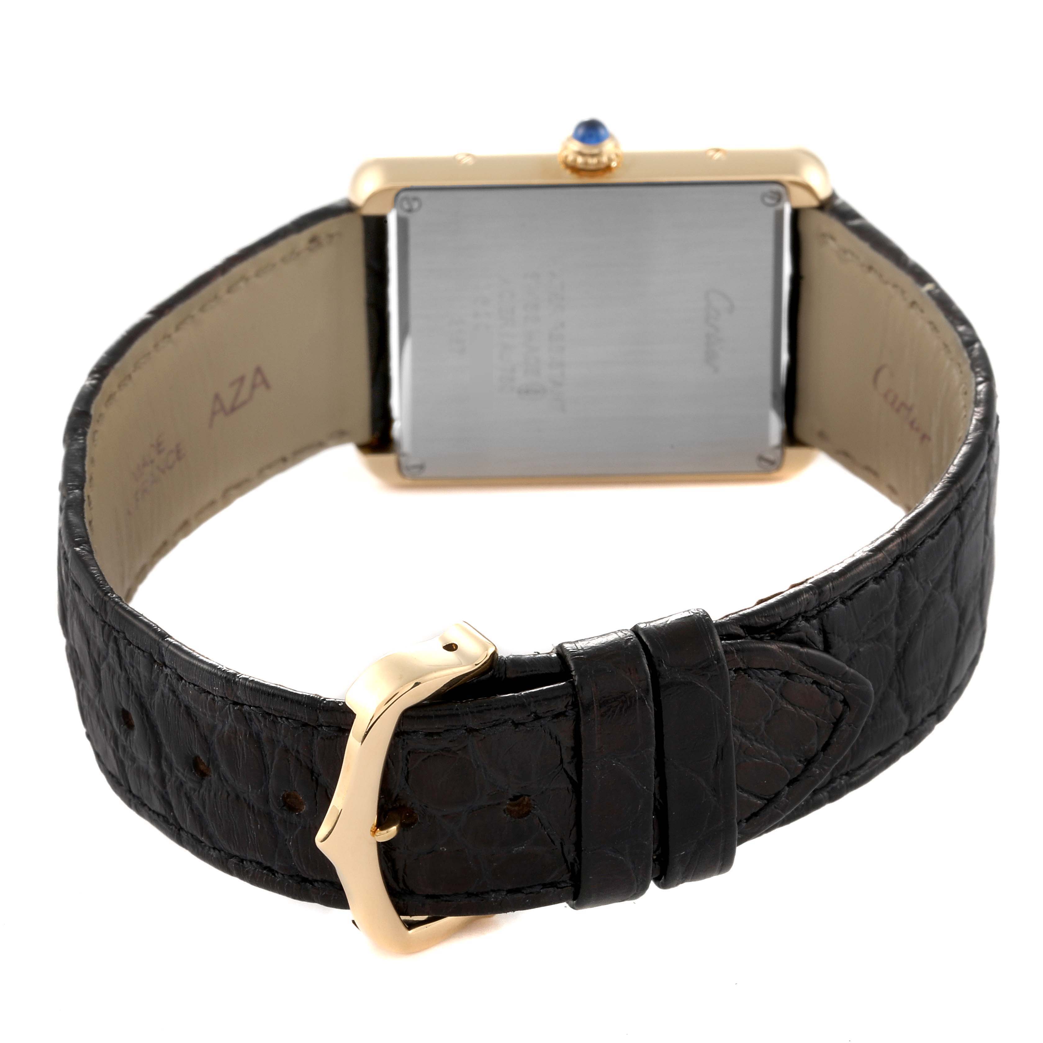 The image shows the back of a Cartier Tank Solo W5200004 Men
s Steel and Gold (two tone) Silver Dial W5200004 Men
s Steel and Gold (two tone) Silver Dial watch, highlighting the rear case, leather strap, and buckle.