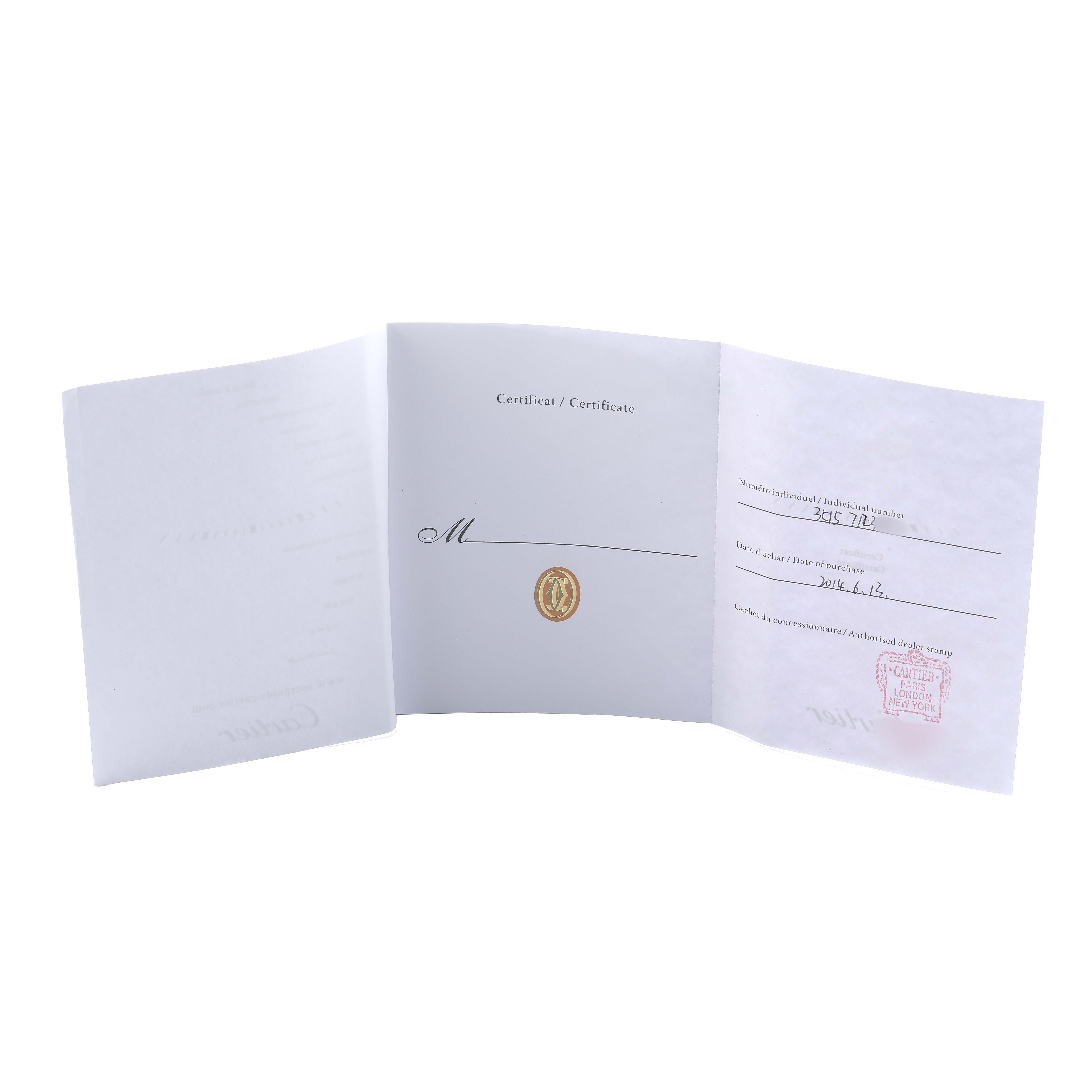 The image shows the open certificate booklet for the Cartier Tank Solo W5200027 Men's Stainless Steel Silver Dial watch, displaying text and a red stamp.