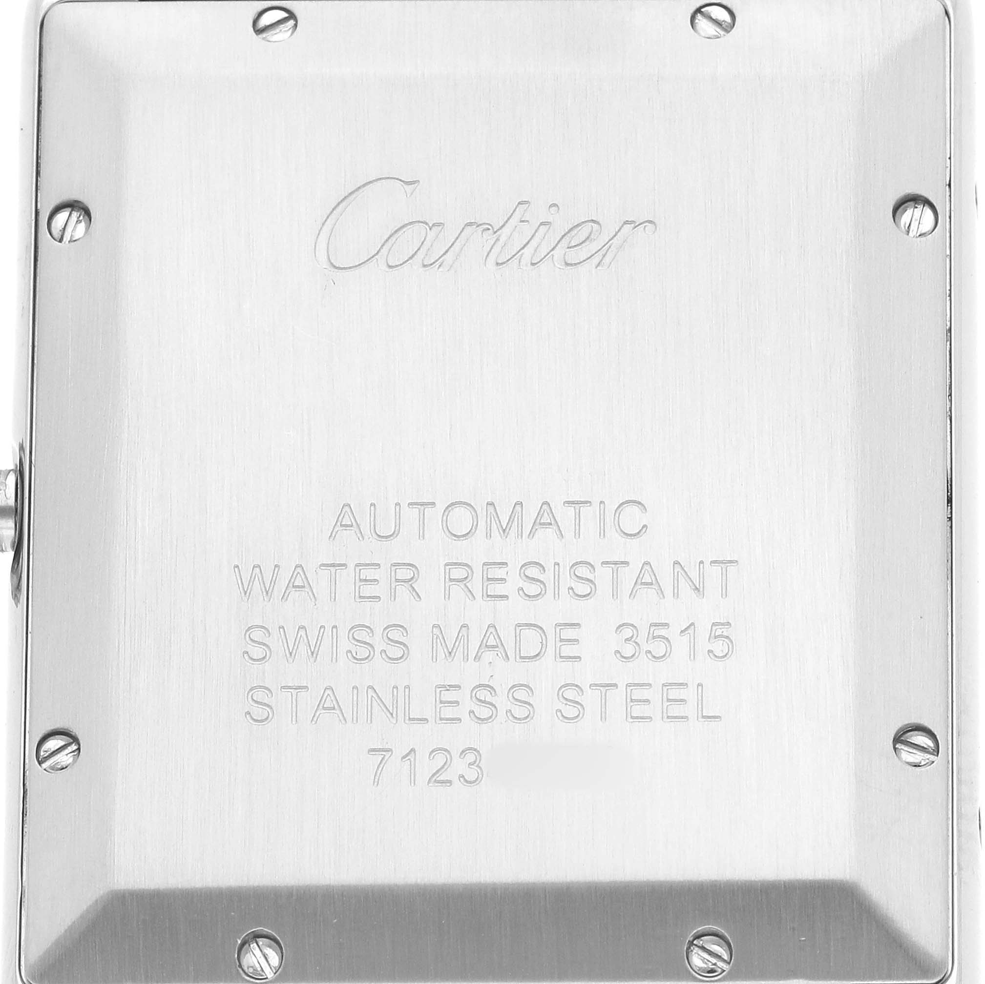 The image shows the back of a Cartier Tank Solo W5200027 Men's Stainless Steel Silver Dial watch with engravings and screws.