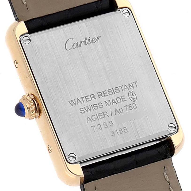 The image shows the back case of a Cartier Tank Solo W5200002 Women's Yellow Gold Silver Dial W5200002 Women's Yellow Gold Silver Dial watch, emphasizing its markings and leather strap.