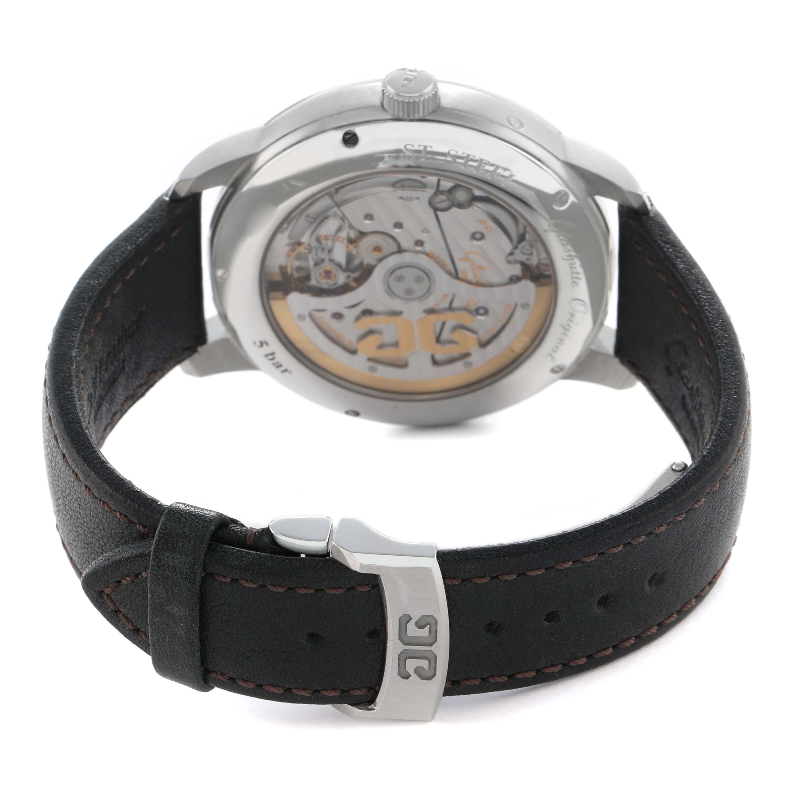 The Glashütte Senator watch is shown from the back, highlighting its transparent case back and leather strap with clasp.