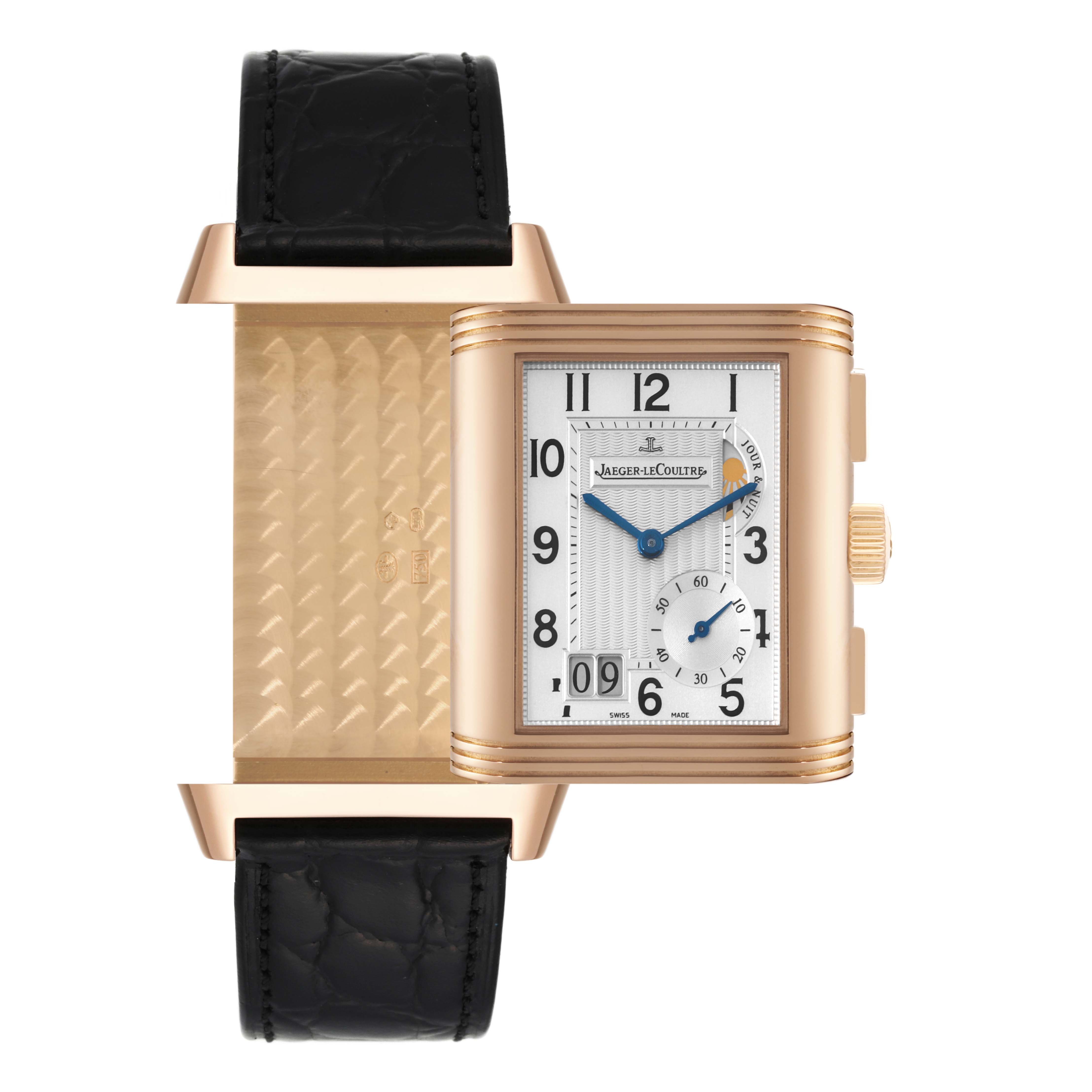 The image shows a Jaeger-LeCoultre Reverso watch partially flipped, displaying both the watch face and the reverse side with engravings.