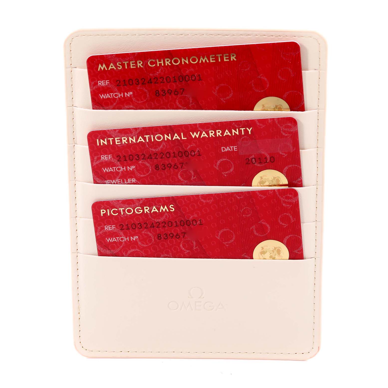 The image shows three red cards (Master Chronometer, International Warranty, Pictograms) for the Omega Seamaster 210.32.42.20.10.001 Men's Stainless Steel Green Dial 210.32.42.20.10.001 Men's Stainless Steel Green Dial watch in a cream cardholder.