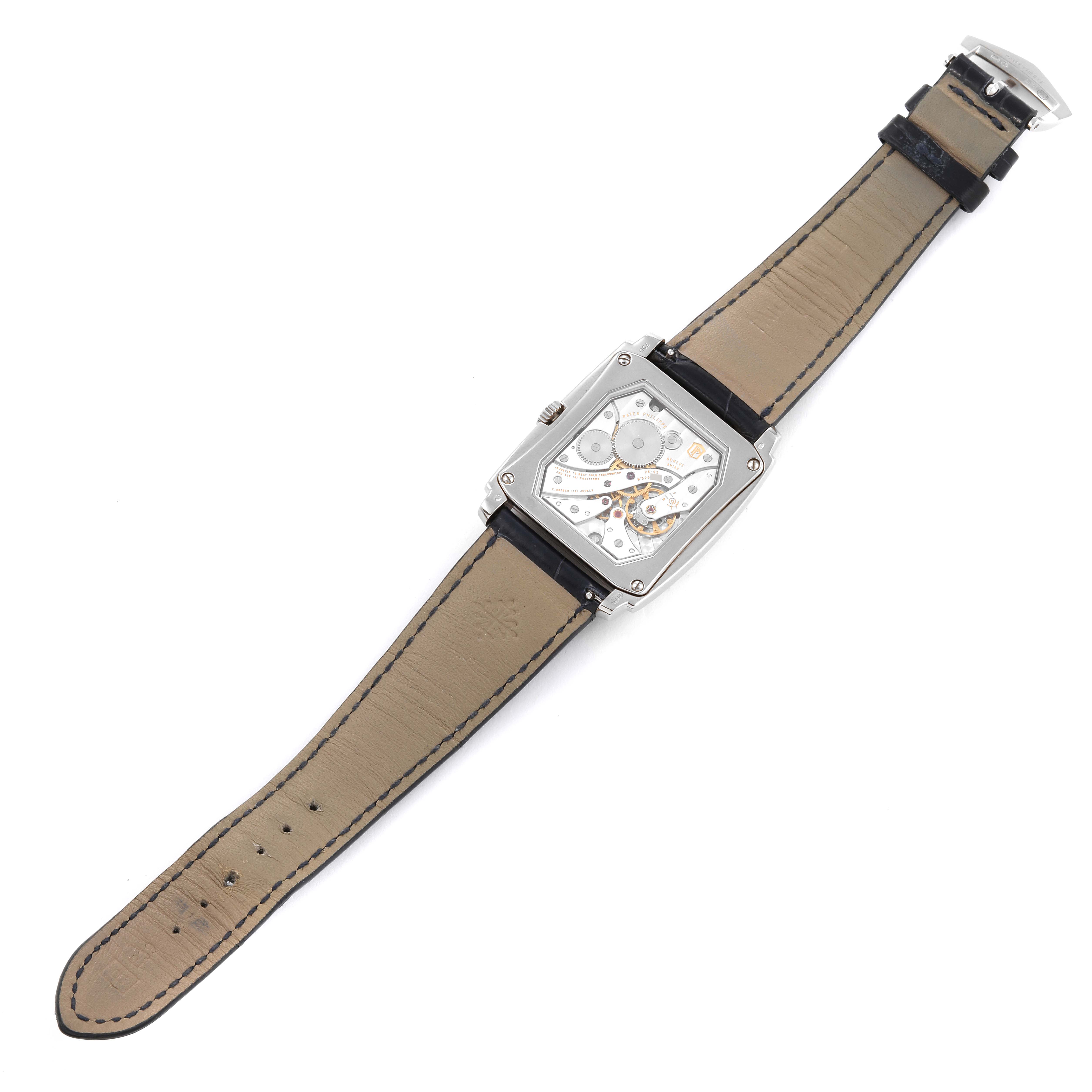 The image shows the back view of the Patek Philippe Gondolo 5124G Men's White Gold Blue Dial 5124G Men's White Gold Blue Dial watch, displaying its movement, complete with leather straps.