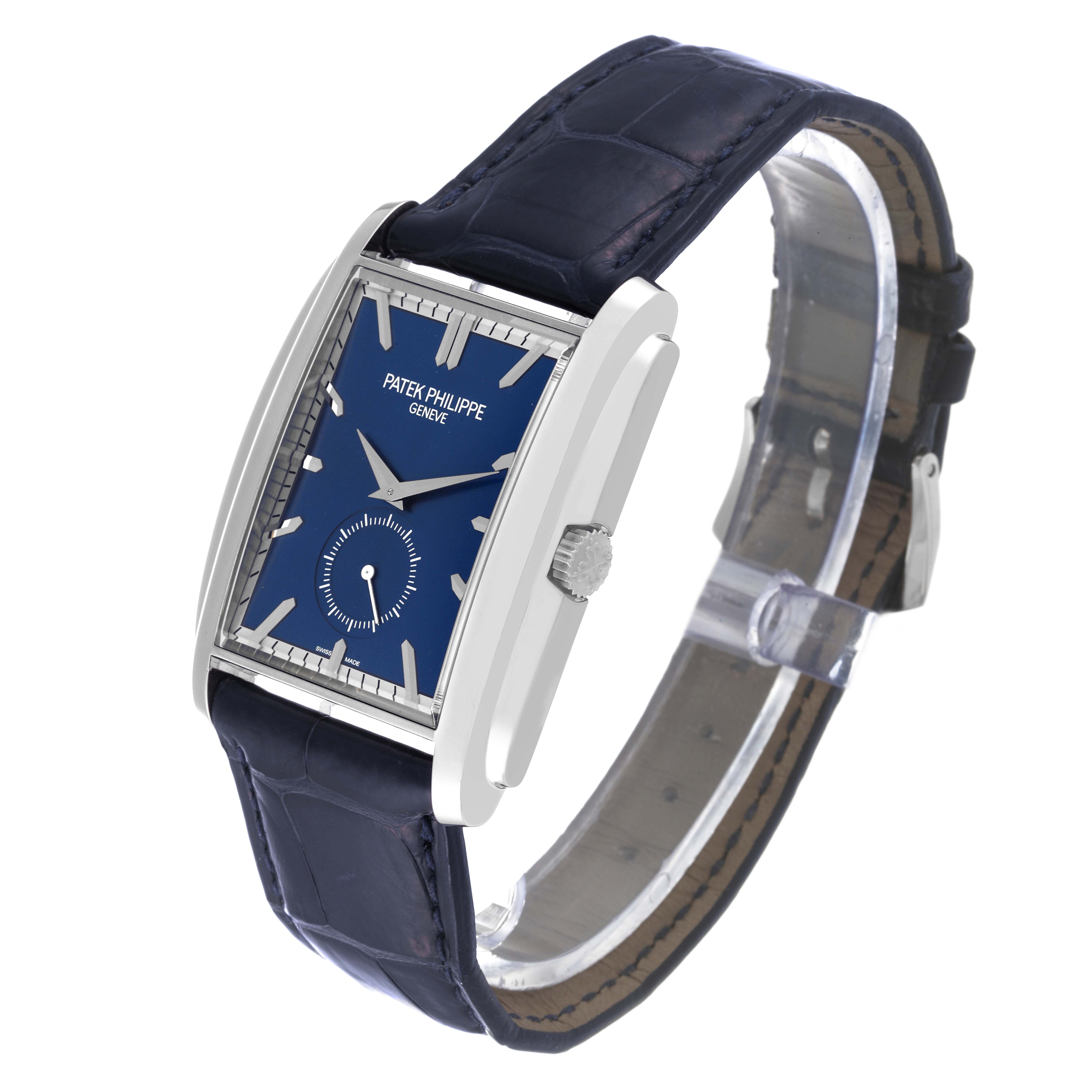 The image shows a side-angle view of the Patek Philippe Gondolo 5124G Men's White Gold Blue Dial 5124G Men's White Gold Blue Dial watch, highlighting its rectangular case, crown, and strap.