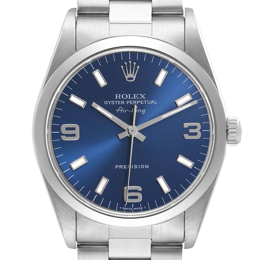 The Rolex Air-King watch is shown from the front, featuring its blue dial, silver hour markers, and the crown.