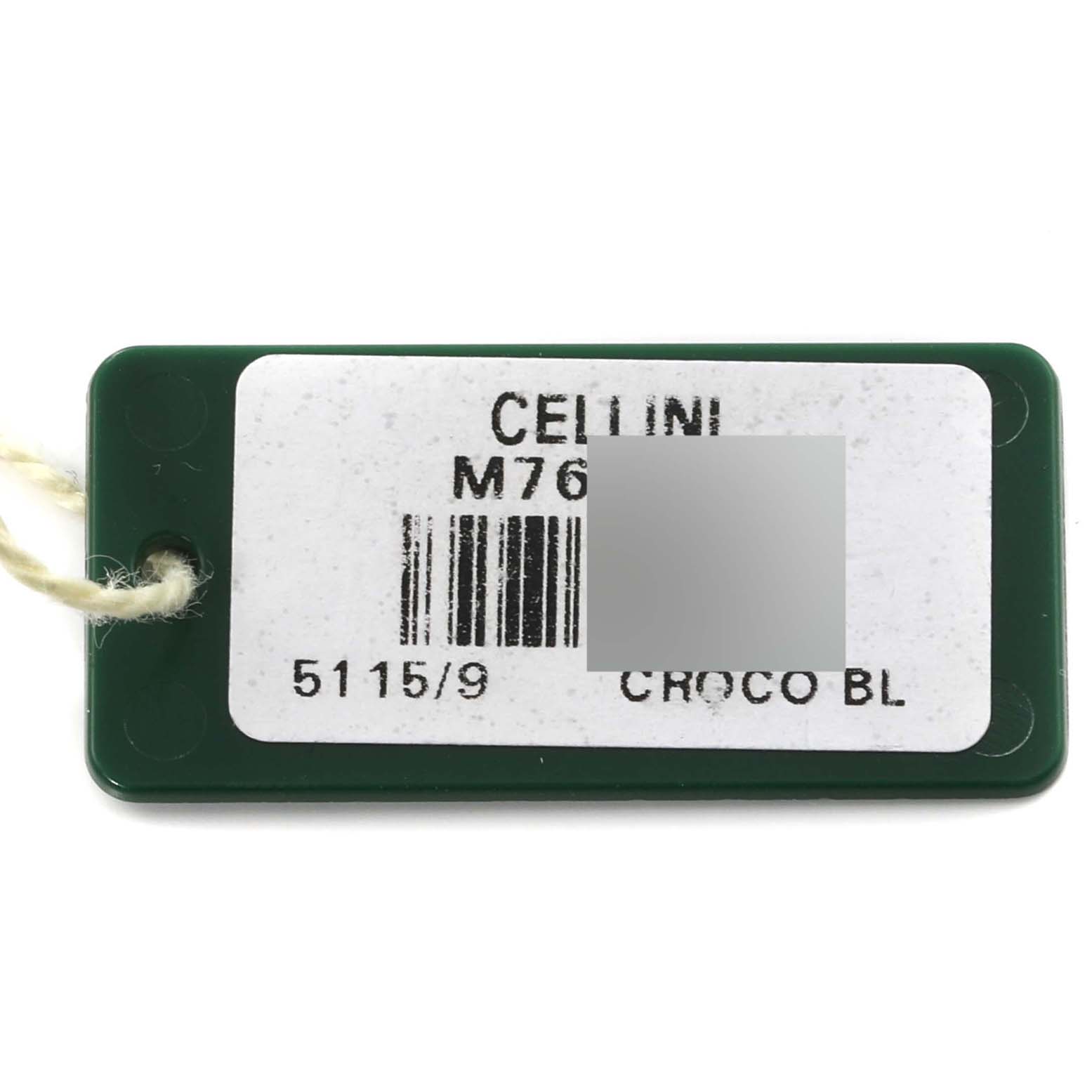 The image shows a green plastic tag with a barcode and details for a Rolex Cellini 5115/9 Men's White Gold Beige Dial 5115/9 Men's White Gold Beige Dial model, including a string.