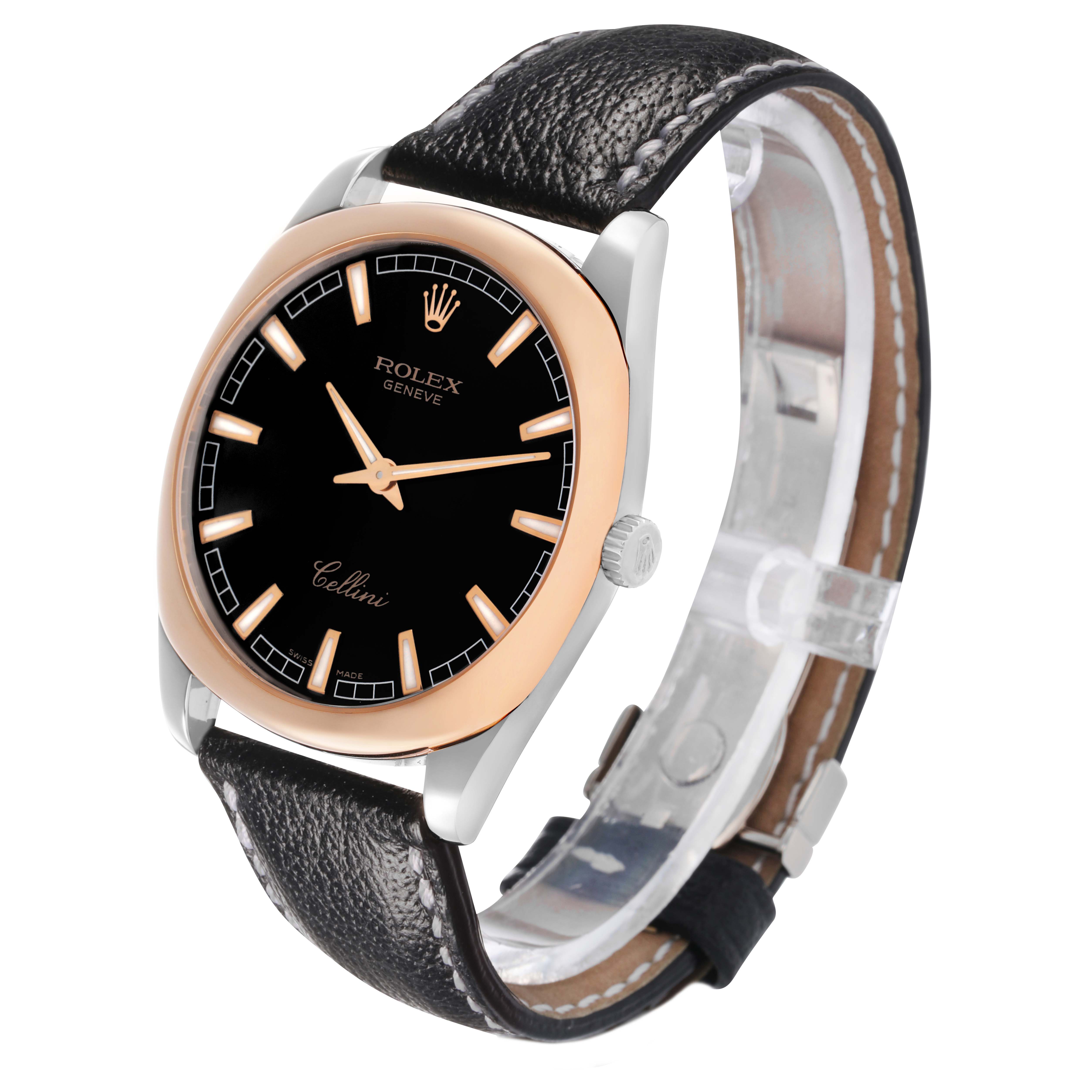 The Rolex Cellini 4243/9-BIC Men's White Gold Black Dial watch is shown at an angled side view, highlighting its black dial, rose gold bezel, and leather strap.