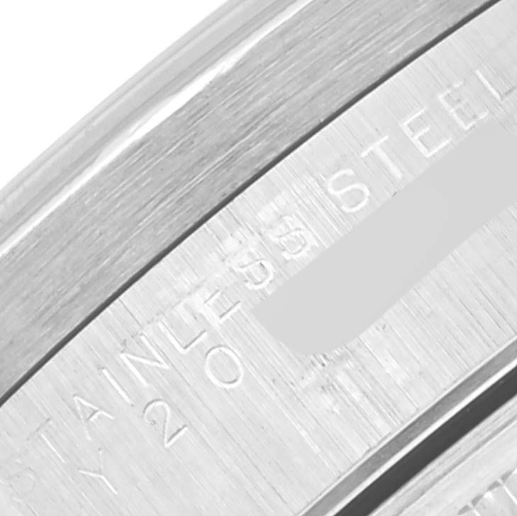 This close-up image shows the engraving on the stainless steel back of a Rolex Date 15210 Men's Stainless Steel Black Dial 15210 Men's Stainless Steel Black Dial model watch.