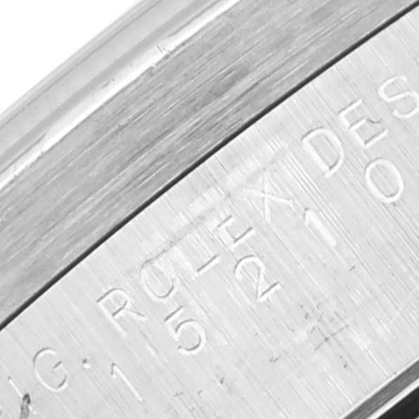 This image shows an angled close-up of the engravings on the outer rim of a Rolex Date 15210 Men's Stainless Steel Black Dial 15210 Men's Stainless Steel Black Dial model watch.