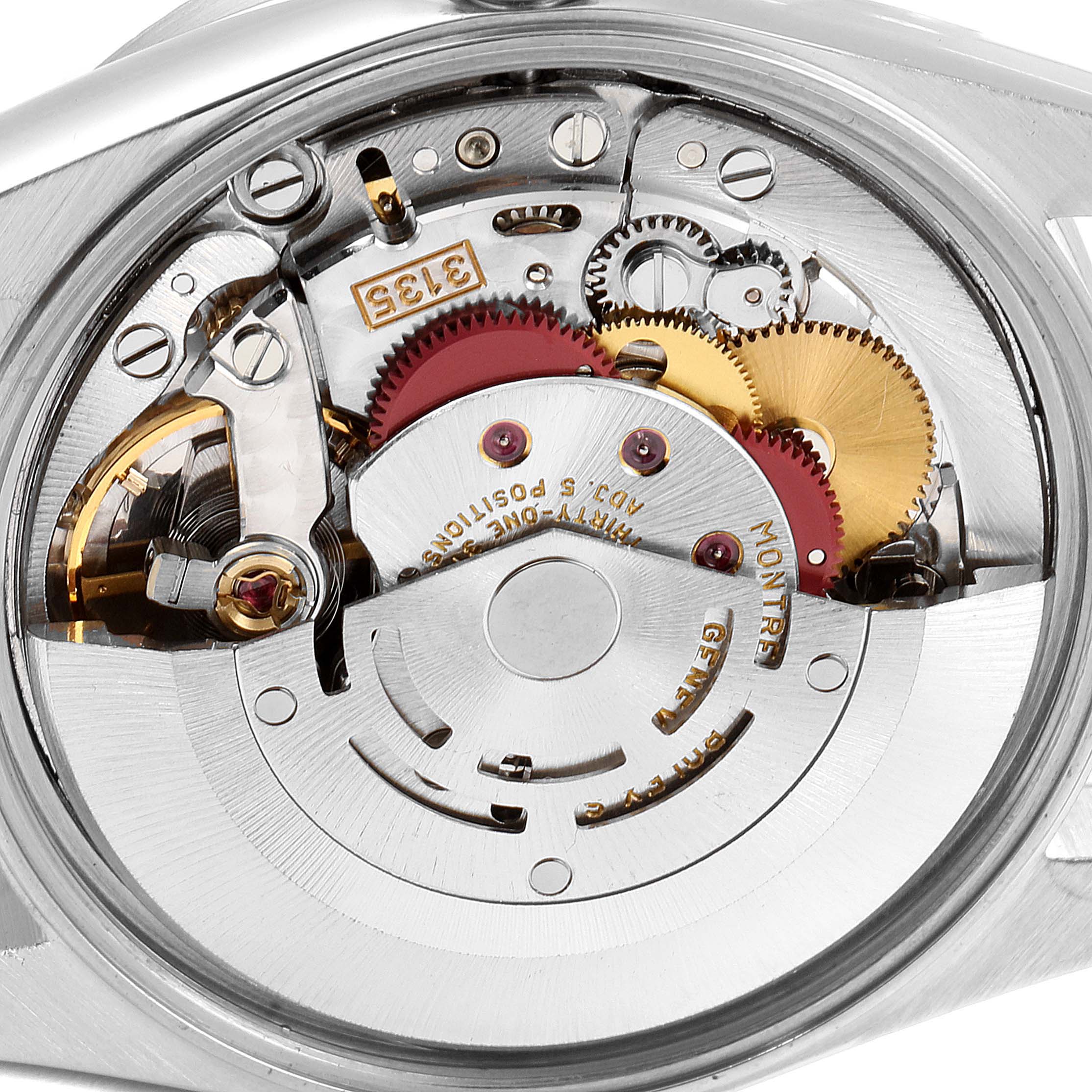 This image shows the movement and inner mechanisms of a Rolex Date 15210 Men's Stainless Steel Blue Dial 15210 Men's Stainless Steel Blue Dial model watch, from a close-up angle.