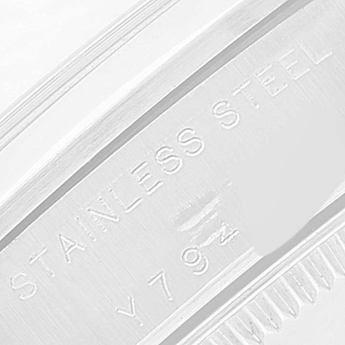 This close-up image shows the engraved "STAINLESS STEEL" on the case side of a Rolex Mid-Size 78240 Women
s Stainless Steel Blue Dial 78240 Women
s Stainless Steel Blue Dial model watch.