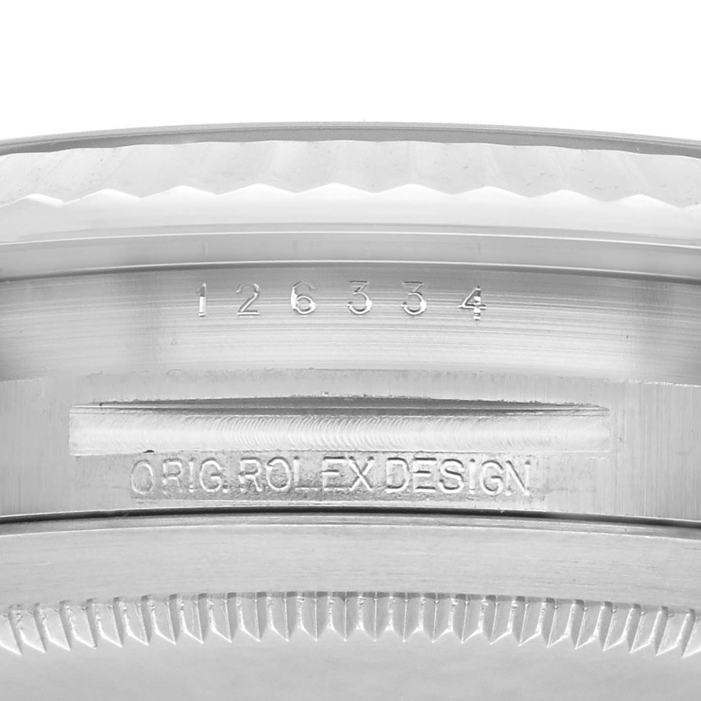 The image shows a close-up of the side of the Rolex Datejust 41 126334 Men's Stainless Steel Black Dial 126334 Men's Stainless Steel Black Dial, focusing on the model number and "ORIG ROLEX DESIGN" engraving.