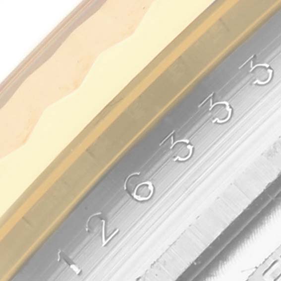 The image shows a close-up of the Datejust 41 by Rolex, focusing on the fluted bezel and part of the steel numbers.