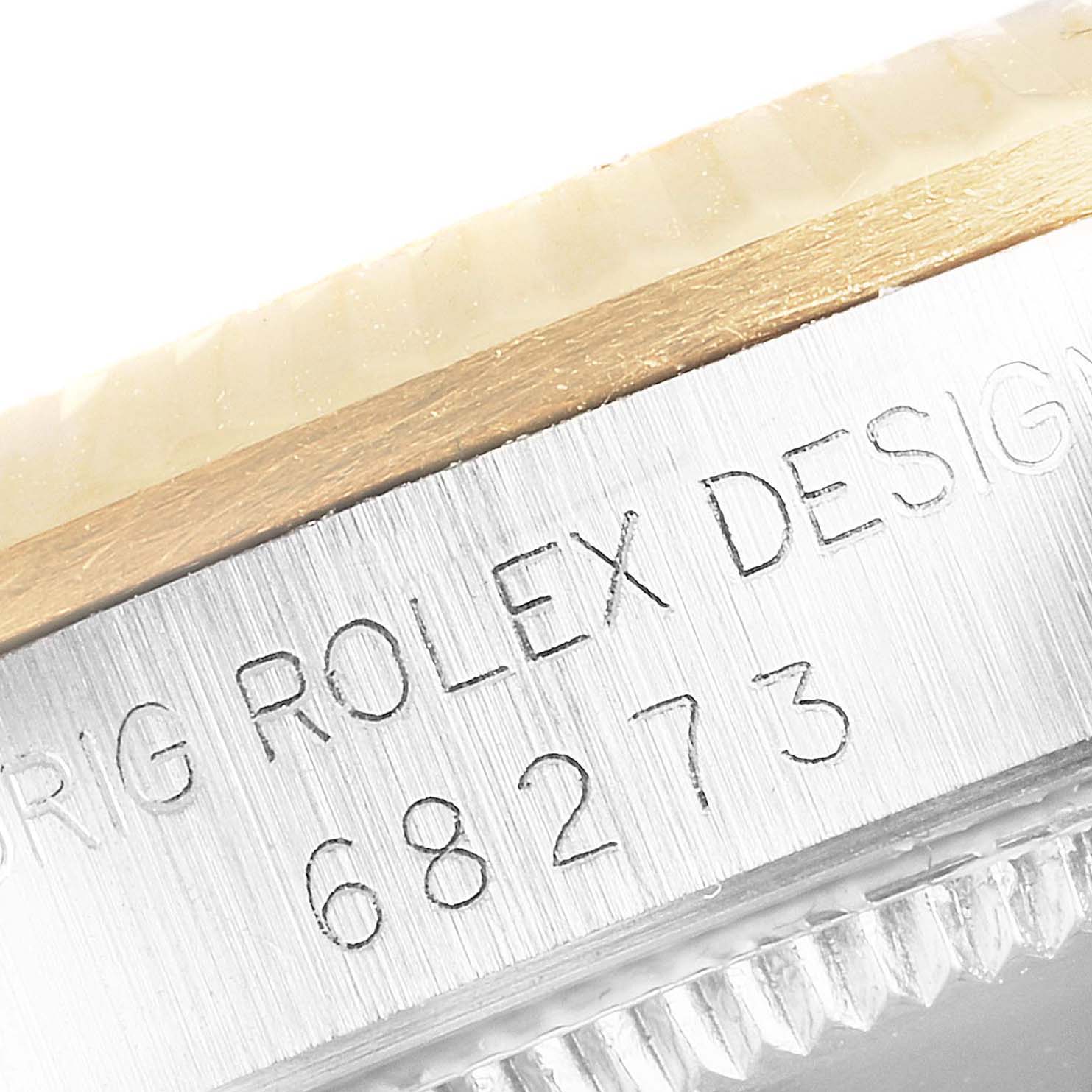 This close-up image shows the model number engraving on the side case of a Rolex Datejust 68273 Women's Steel and Gold (two tone) White Dial 68273 Women's Steel and Gold (two tone) White Dial watch.