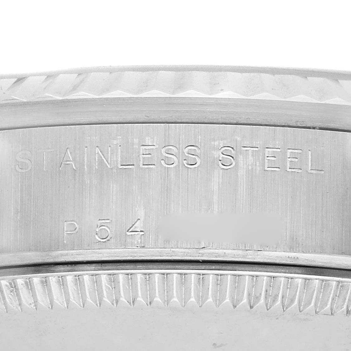The image shows a close-up of the side of a Rolex Datejust 78274 Women's Stainless Steel Silver Dial watch, featuring engravings on the stainless steel bezel.