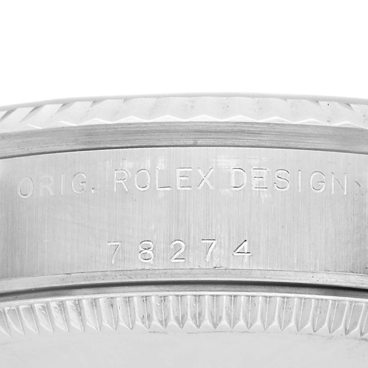 The image shows a close-up of the side of a Rolex Datejust 78274 Women's Stainless Steel Silver Dial, highlighting the serial number and "ORIG. ROLEX DESIGN" engraving.