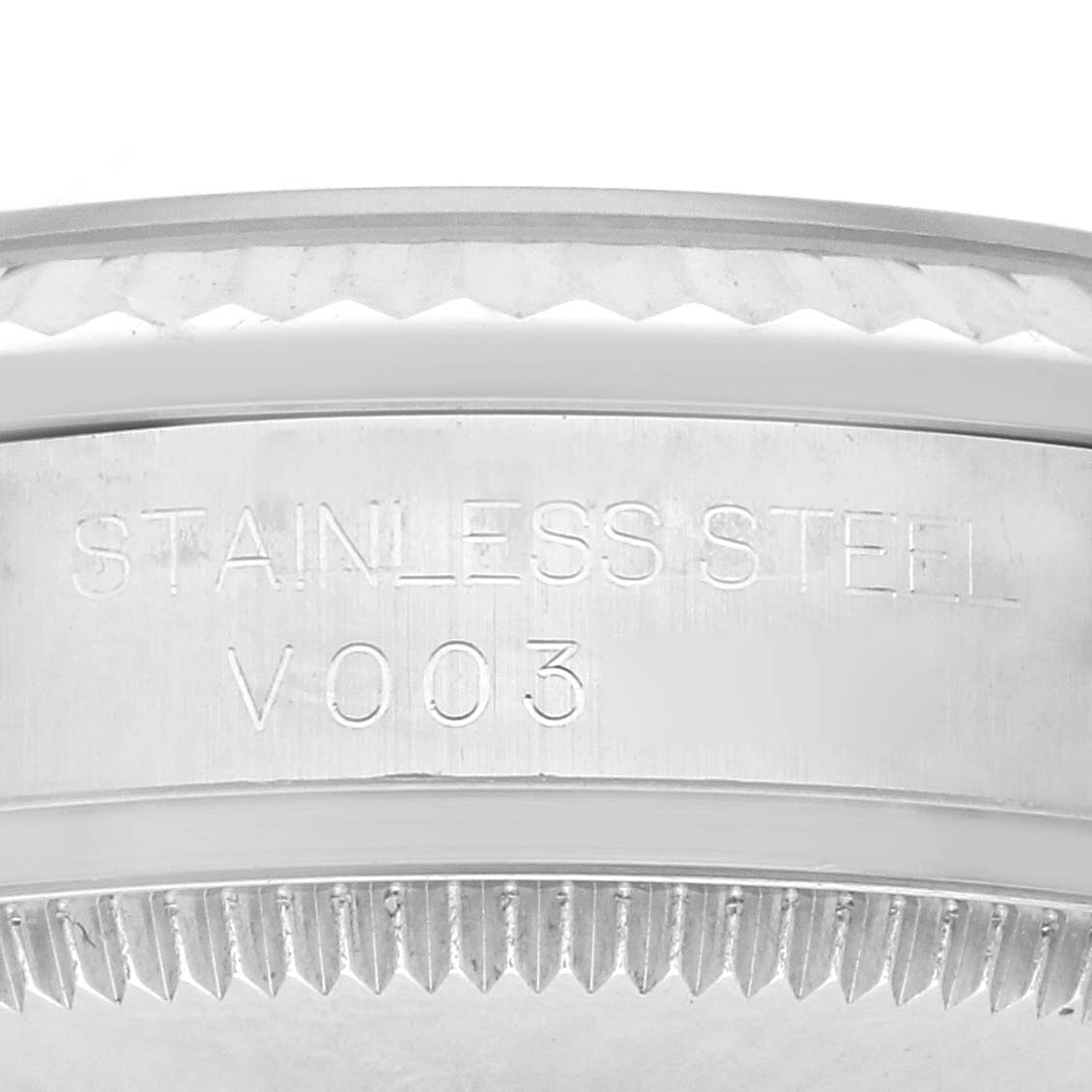 The image shows a close-up of the side of a Rolex Mid-Size 178274 Women's Stainless Steel Blue Dial 178274 Women's Stainless Steel Blue Dial watch, highlighting the stainless steel and a fluted bezel.