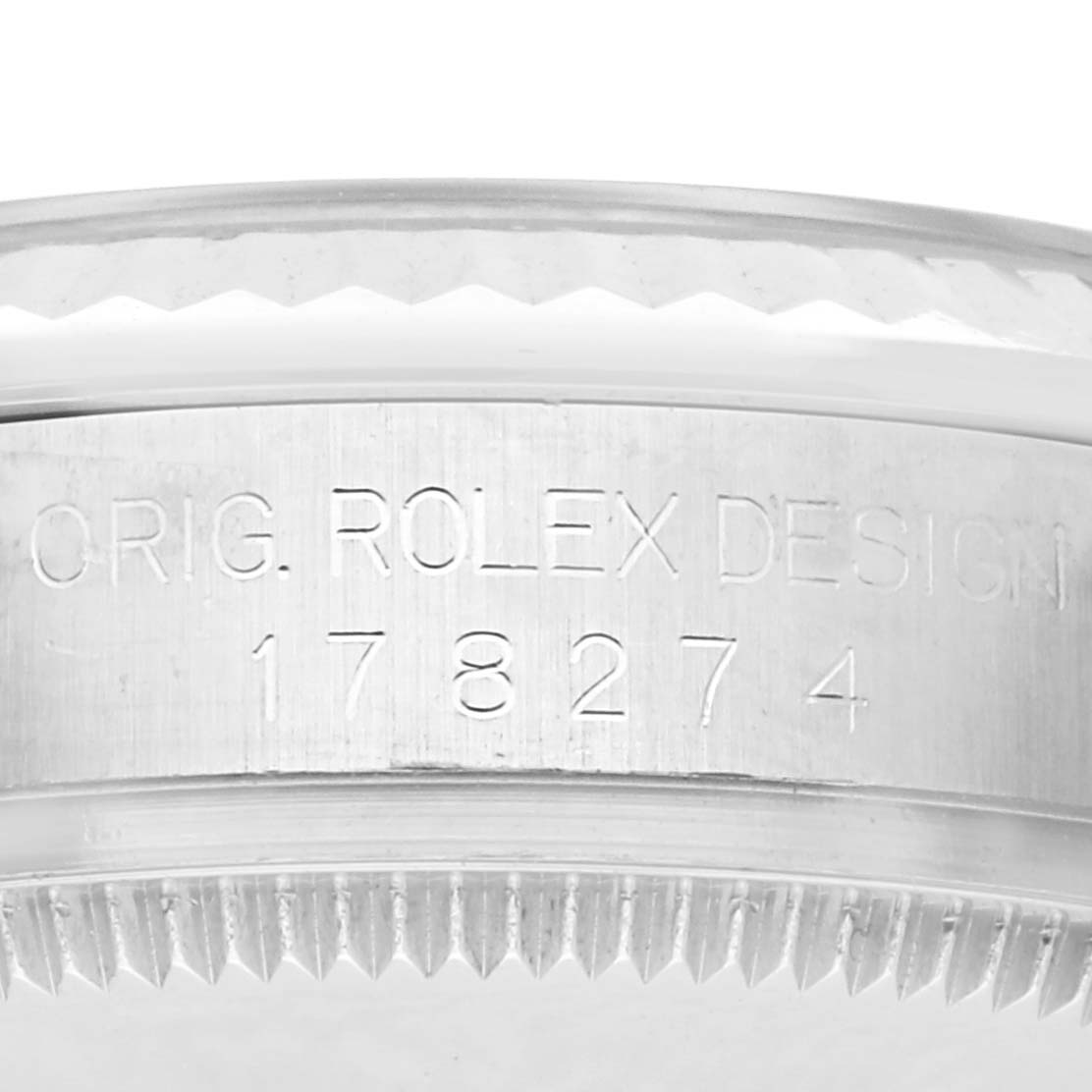 The image shows the side of a Rolex Mid-Size 178274 Women's Stainless Steel Blue Dial 178274 Women's Stainless Steel Blue Dial watch's bezel with engraved text and model number.