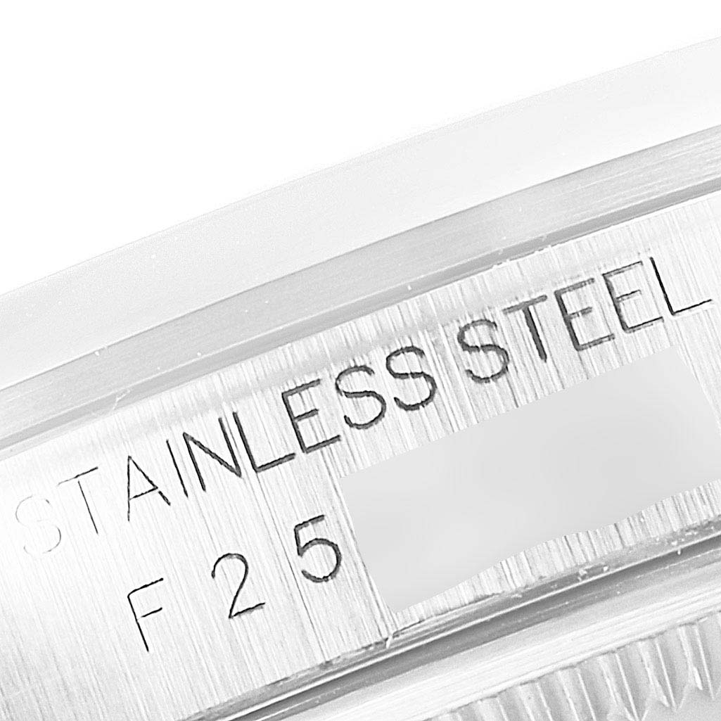 This close-up image shows the stainless steel engravings and part of the serial number on the bezel of a Rolex Datejust 16200 Men's Stainless Steel Silver Dial 16200 Men's Stainless Steel Silver Dial watch.