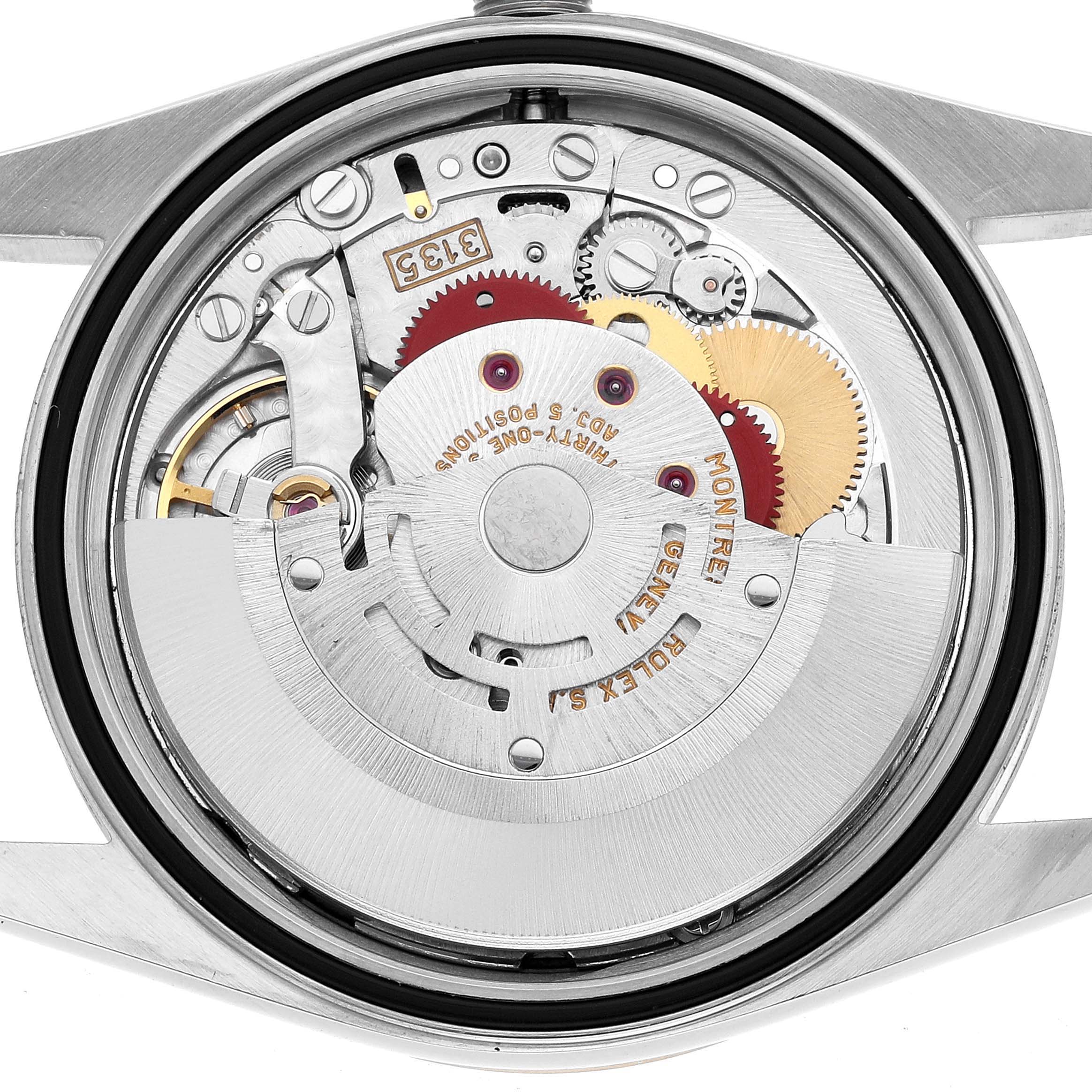 The image shows the movement of a Rolex Datejust 16233 Men's Steel and Gold (two tone) Black Dial from a backside view, highlighting gears and the rotor.