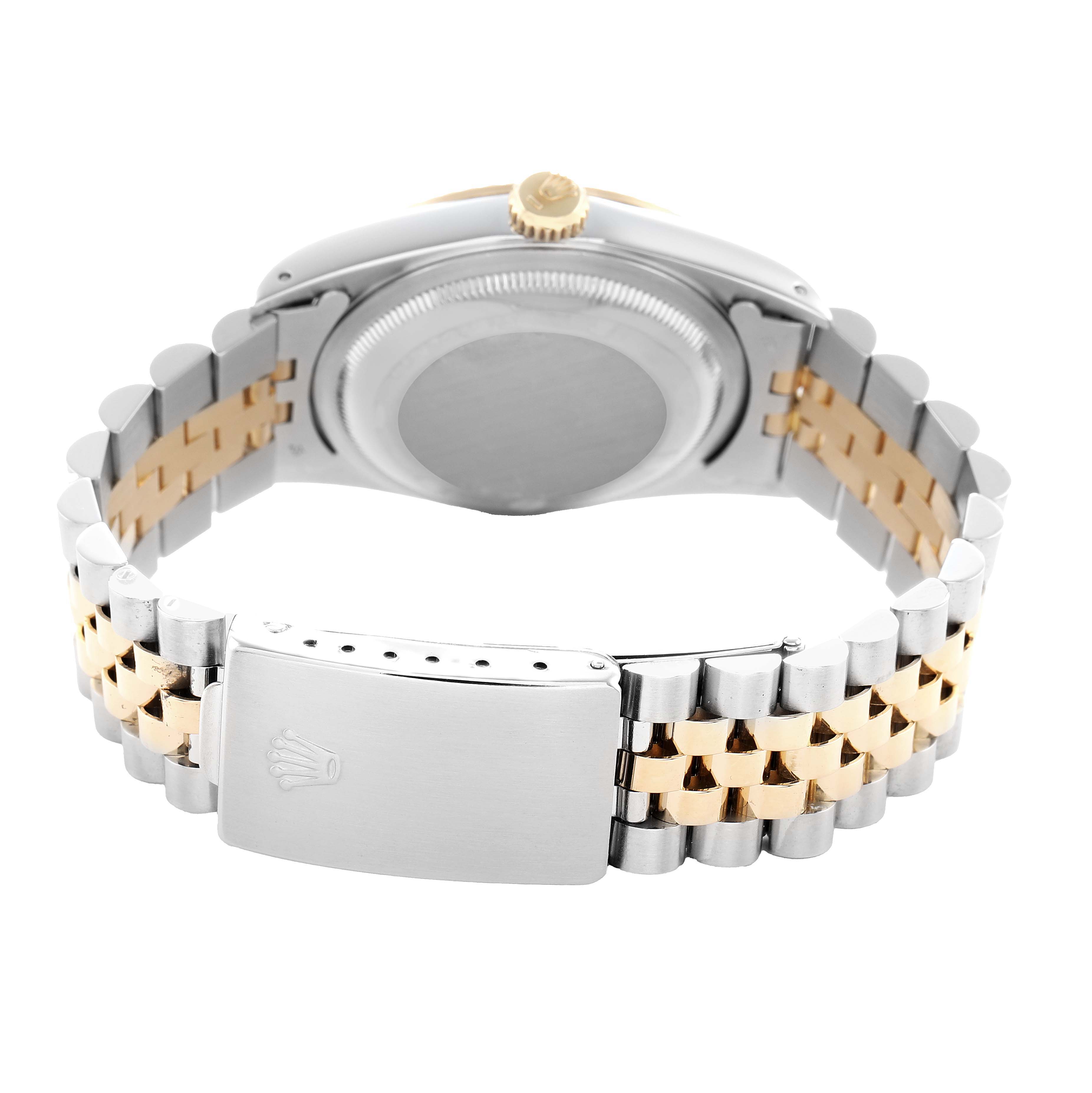 The Rolex Datejust 16233 Men's Steel and Gold (two tone) Black Dial is shown from the back, highlighting the clasp and two-tone bracelet.