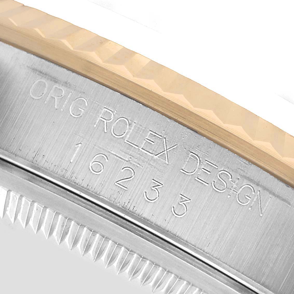 The image shows a close-up of the side engraving on a Rolex Datejust 16233 Men's Steel and Gold (two tone) Black Dial, displaying the model number and "ORIG ROLEX DESIGN."