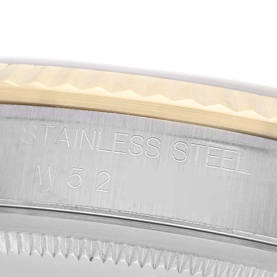 The image shows a close-up of the engraved case back edge of a Rolex Datejust 16233 Men's Stainless Steel Mother of Pearl Dial, highlighting its stainless steel material.