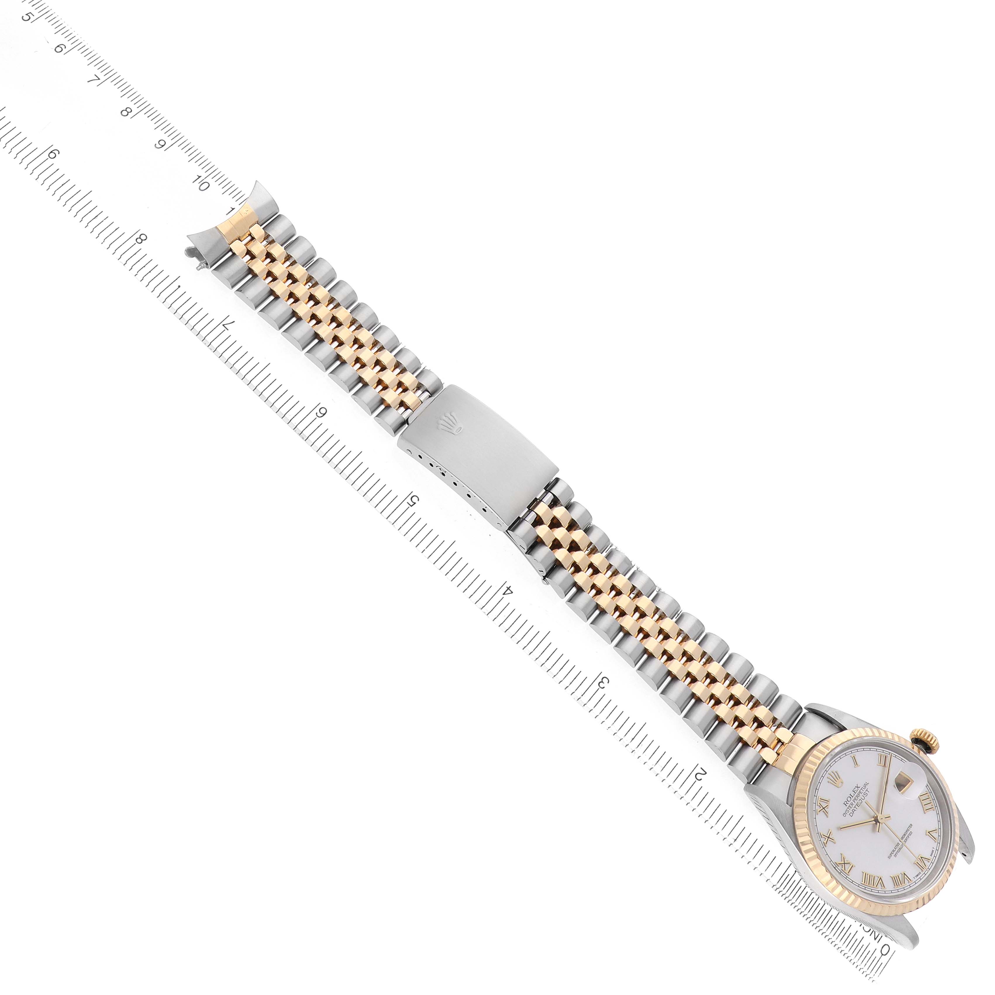 The Rolex Datejust 16233 Men's Stainless Steel Mother of Pearl Dial watch is shown at an angle with its dial, bracelet, and clasp visible, next to a ruler for scale.