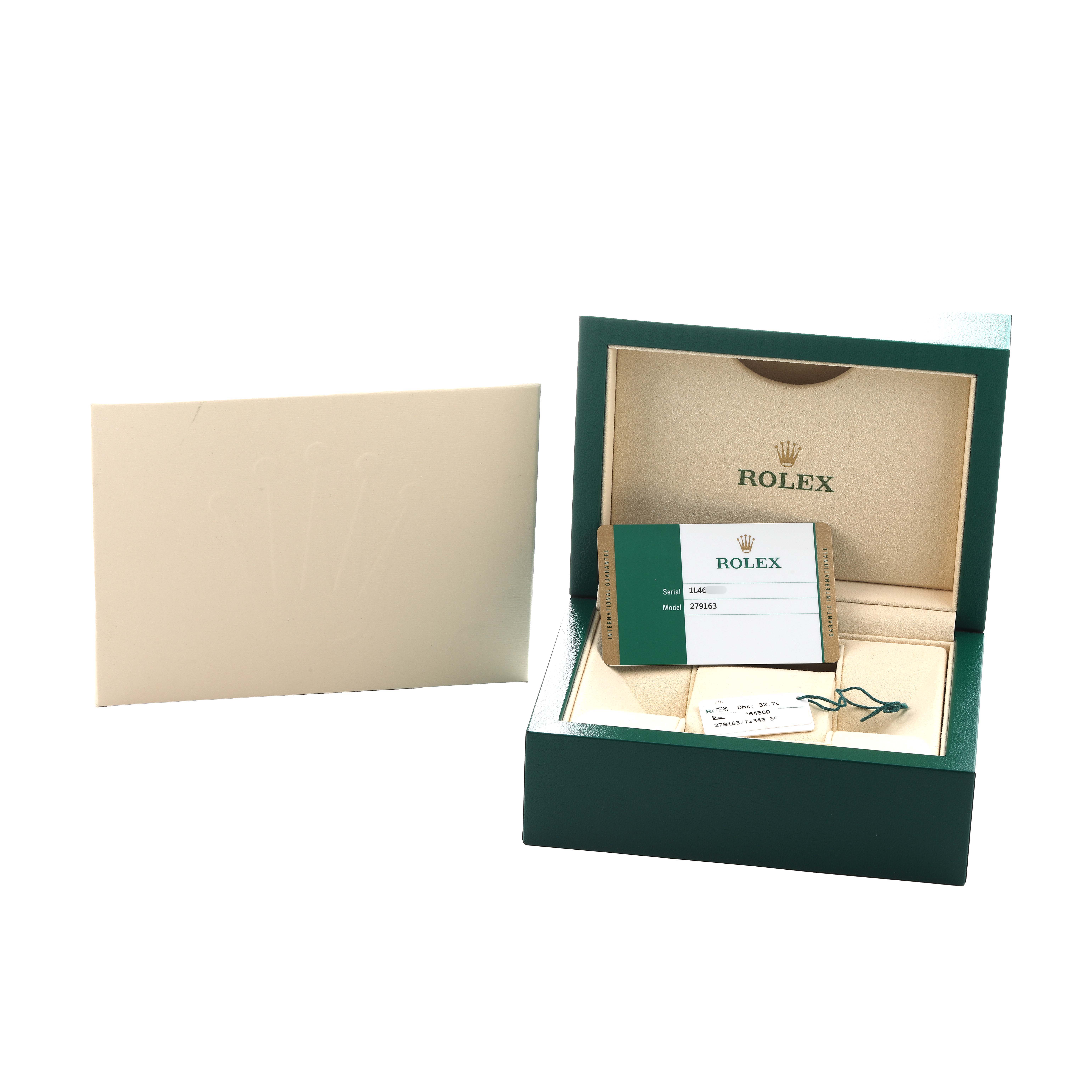 The image shows the packaging and accessories of a Rolex Datejust 279163 Women's Steel and Gold (two tone) White Dial, including the box, warranty card, and tag.