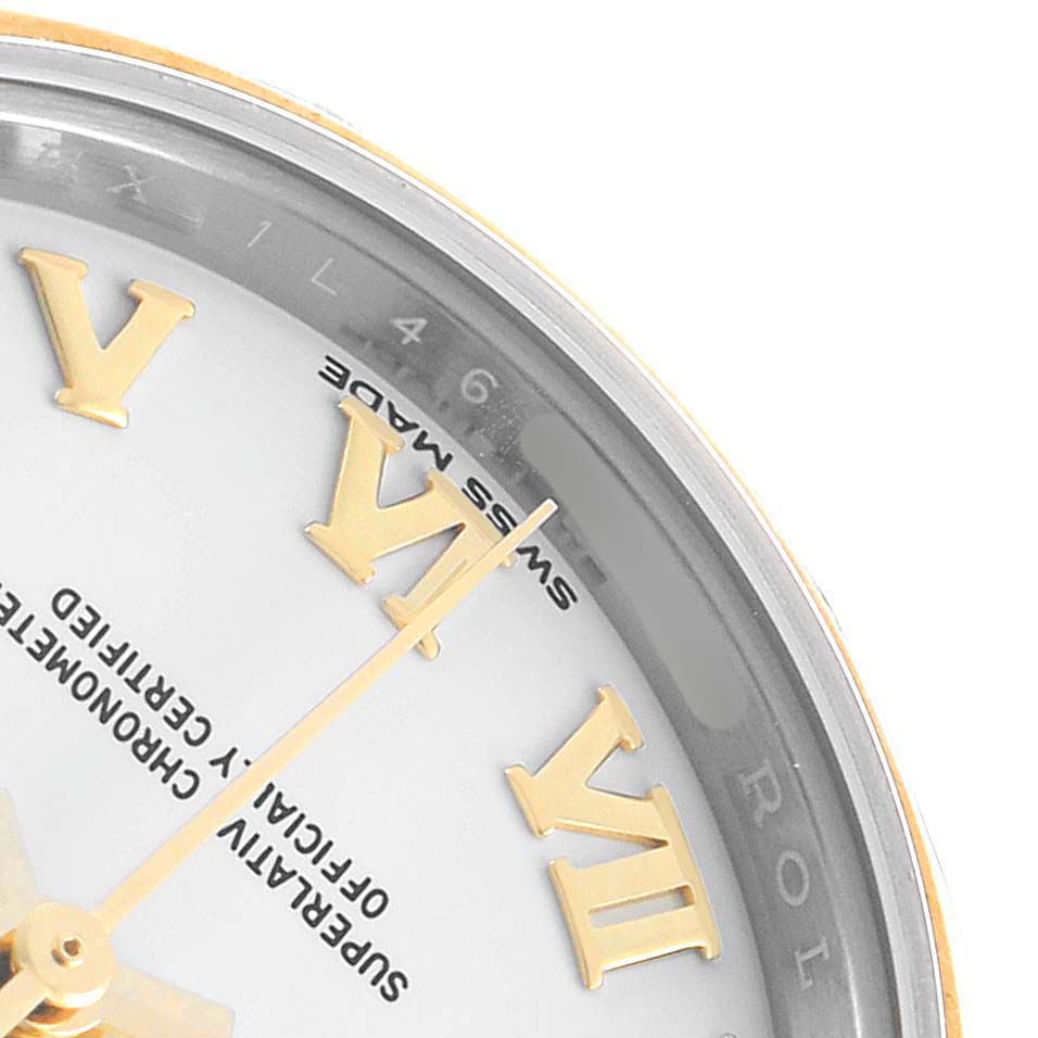 The image shows a close-up of the Rolex Datejust 279163 Women's Steel and Gold (two tone) White Dial watch dial from an angled top view, highlighting the Roman numerals and part of the bezel.