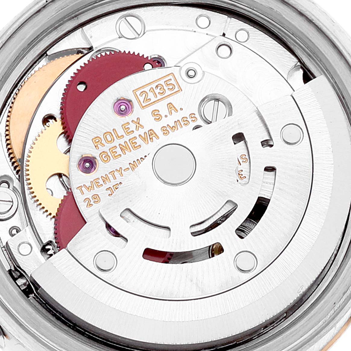 This image shows the intricate internal mechanism and movement parts of a Rolex Datejust 69173 Women's Steel and Gold (two tone) White Dial 69173 Women's Steel and Gold (two tone) White Dial watch, highlighting gears and engravings.
