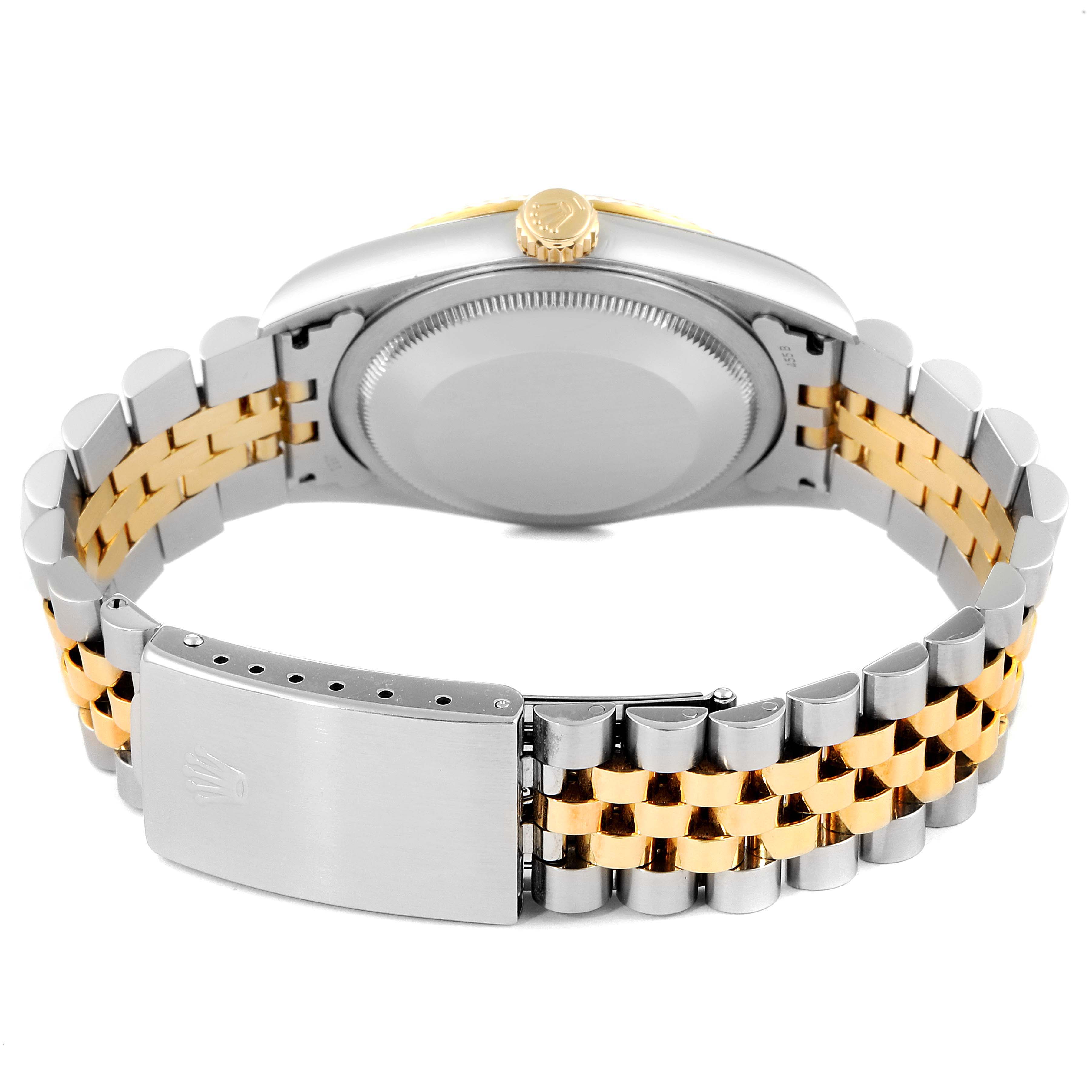 The image shows the back view of a Rolex Datejust 16233 Men's Steel and Gold (two tone) White Dial 16233 Men's Steel and Gold (two tone) White Dial watch, highlighting its case back, crown, and two-tone bracelet.