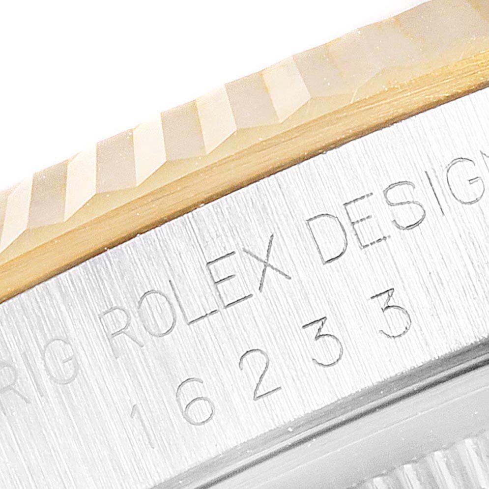 Zoomed-in view of the case side of a Rolex Datejust 16233 Men's Steel and Gold (two tone) White Dial 16233 Men's Steel and Gold (two tone) White Dial showing the bezel and an engraved reference number.