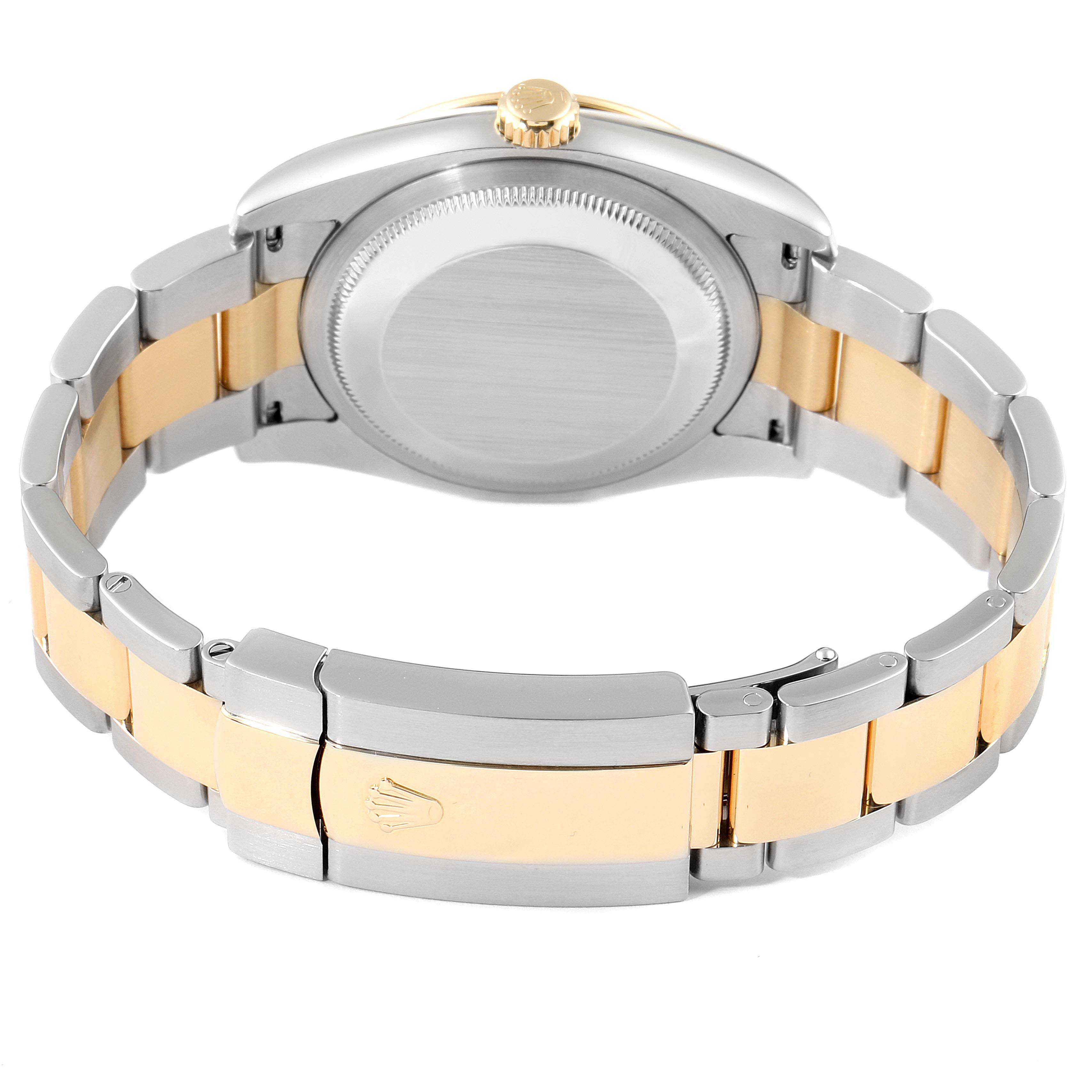 The image shows the back view of a Rolex Turn-o-Graph 116263 Men
s Steel and Gold (two tone) Champagne Dial 116263 Men
s Steel and Gold (two tone) Champagne Dial watch, highlighting its two-tone bracelet and closed clasp.