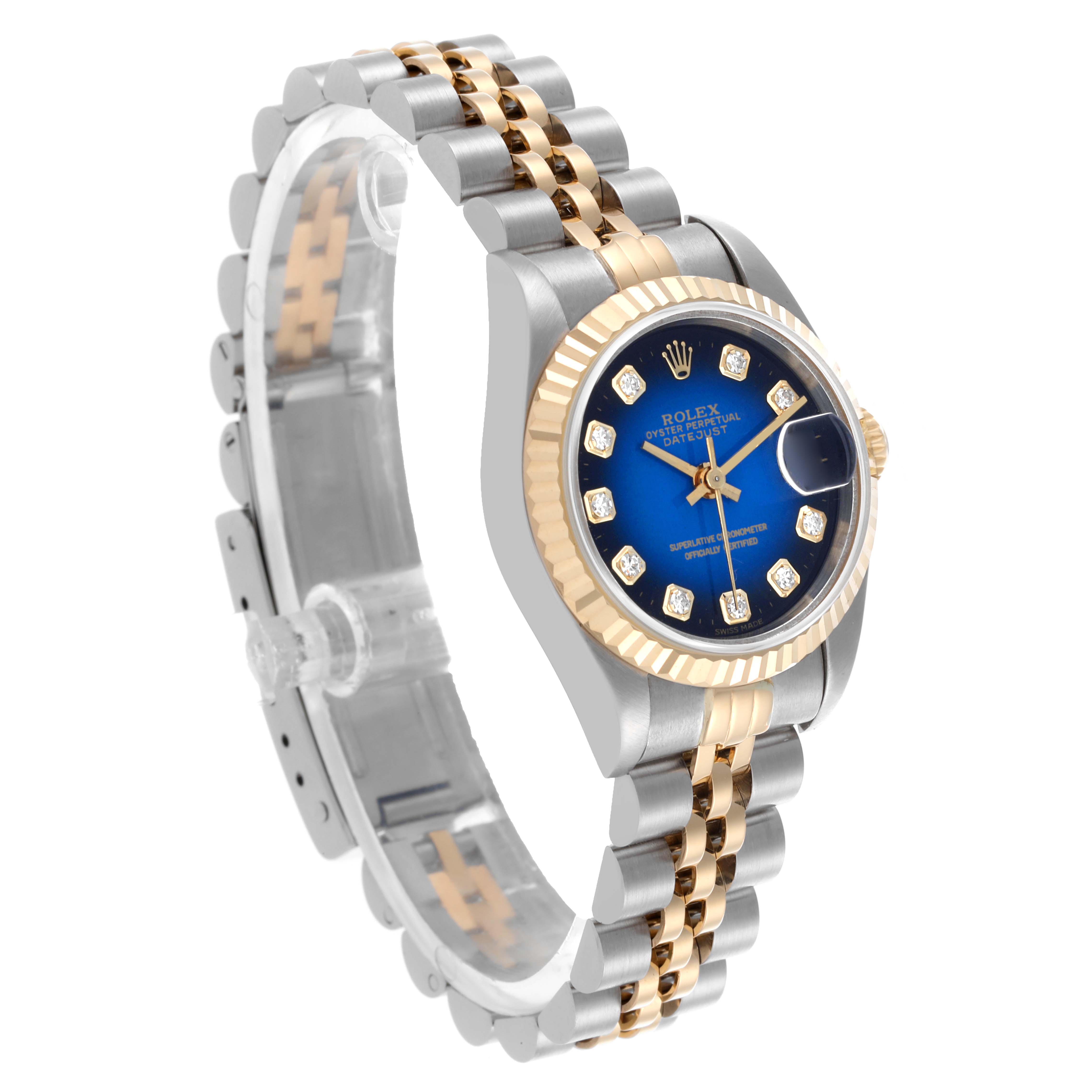 The Rolex Datejust 69173 Women's Steel and Gold (two tone) Blue Dial 69173 Women's Steel and Gold (two tone) Blue Dial watch is shown from an angled side view, displaying the bracelet, dial, and fluted bezel.