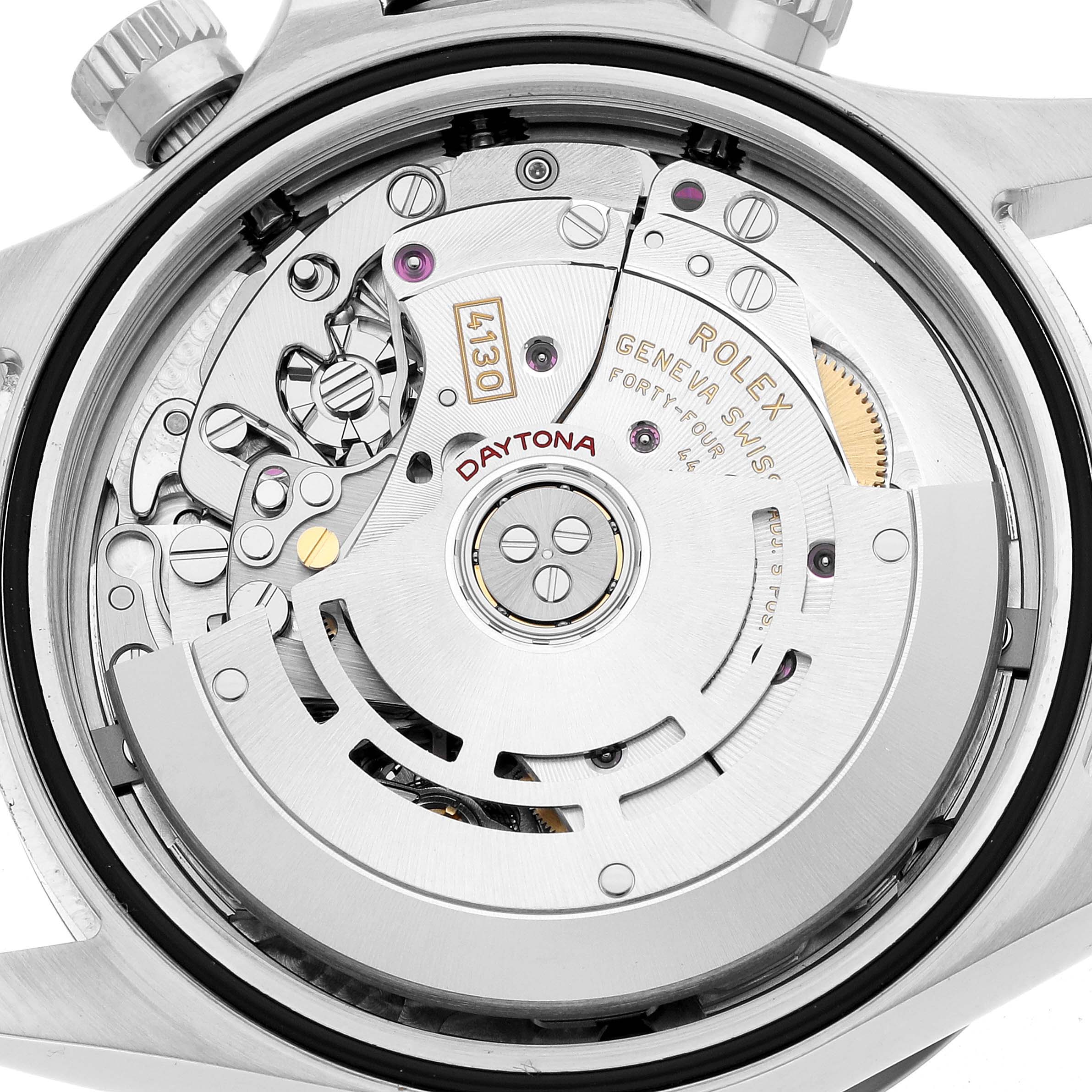 The image shows the back view of a Rolex Daytona 116500LN Men's Stainless Steel Black Dial, highlighting its intricate movement and rotor mechanism.