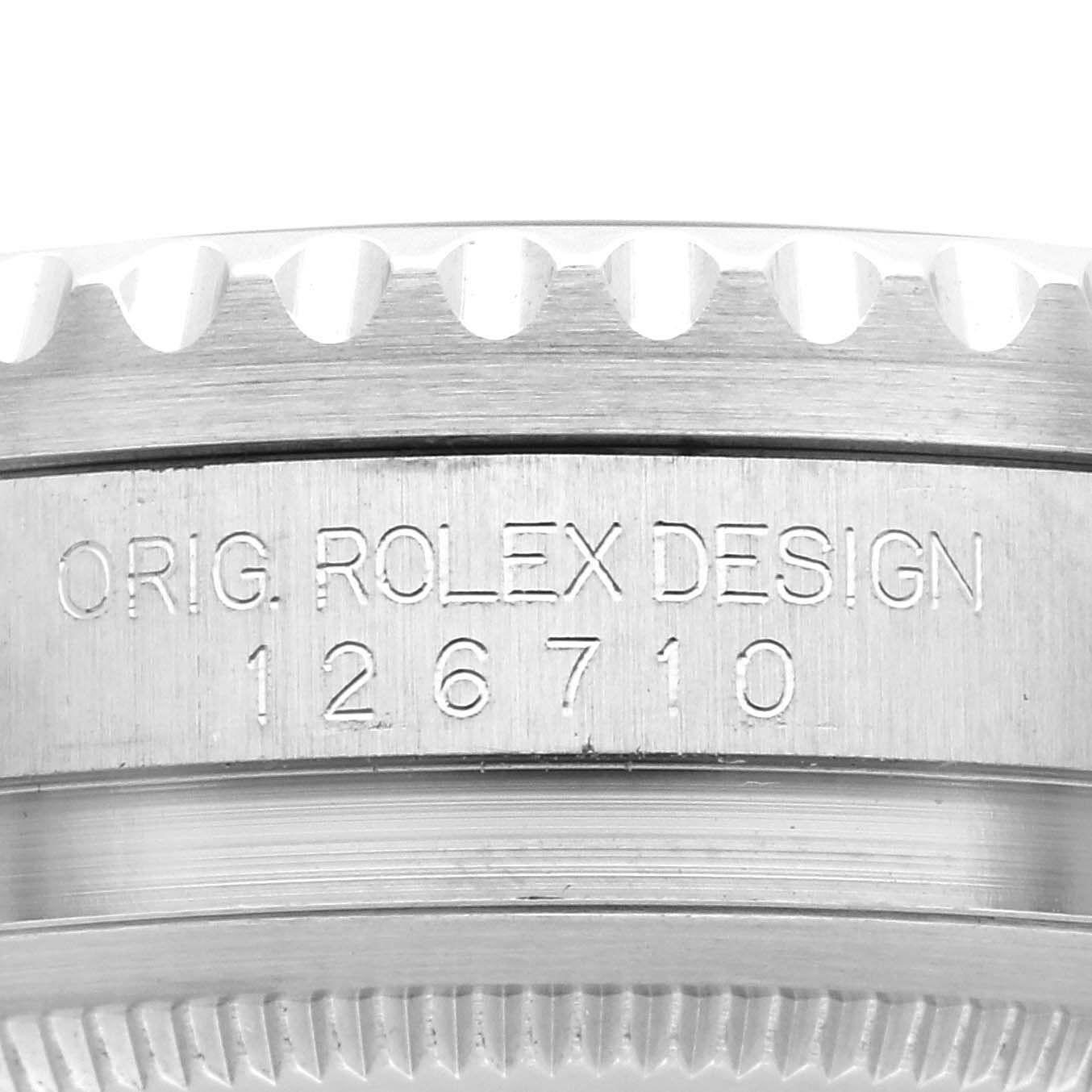 The image shows a close-up of the side of a Rolex GMT-Master 126710BLNR Men's Stainless Steel Black Dial 126710BLNR Men's Stainless Steel Black Dial watch case with the model number engraved.