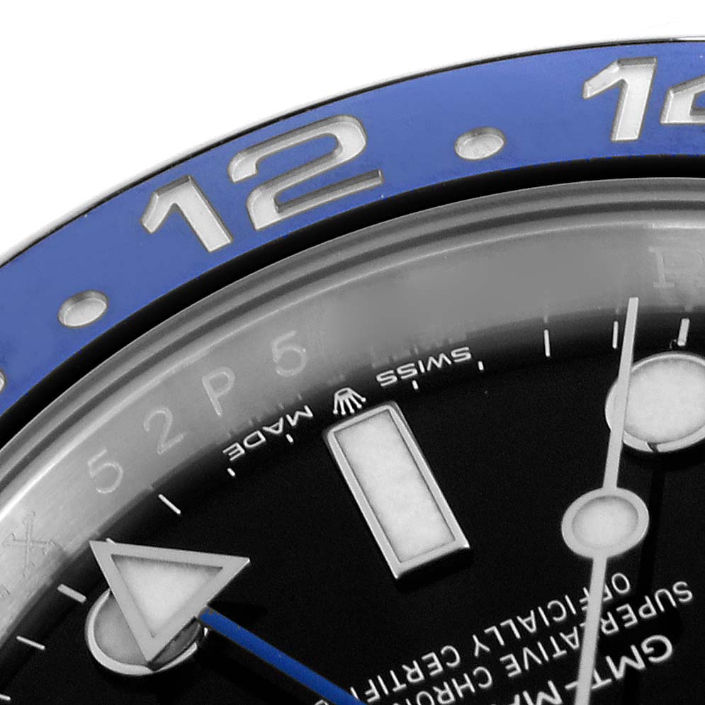 The image shows a partial top-down view of the Rolex GMT-Master 126710BLNR Men's Stainless Steel Black Dial 126710BLNR Men's Stainless Steel Black Dial bezel, dial, and hands.