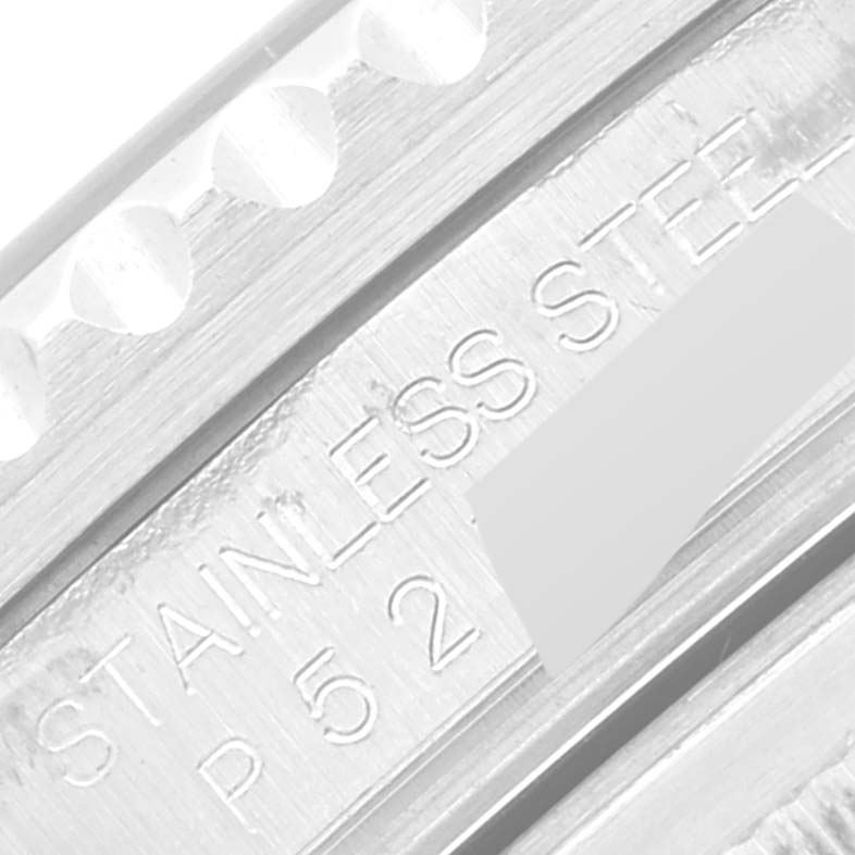 This image shows a close-up of the engraving on the side of a Rolex GMT-Master 16710 Men's Stainless Steel Black Dial 16710 Men's Stainless Steel Black Dial watch, displaying "STAINLESS STEEL" and part of the serial number.