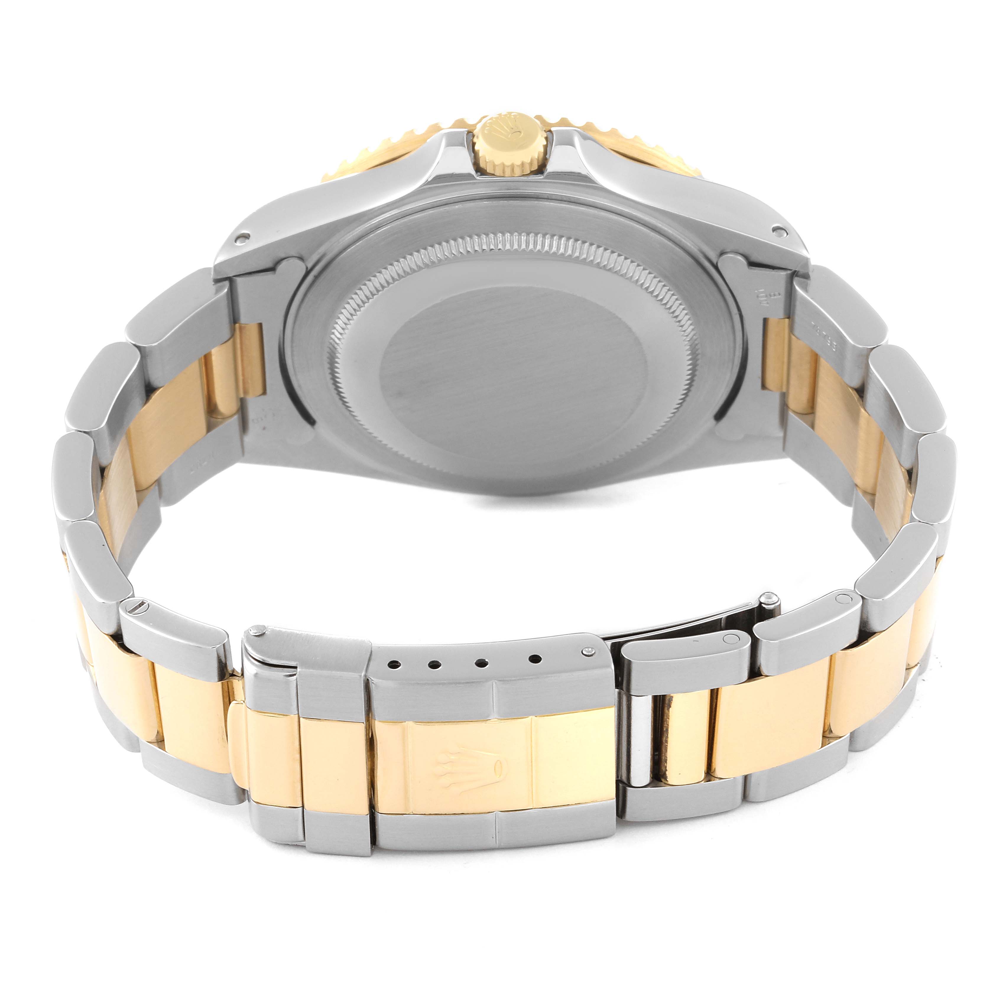 The image shows the back side of the Rolex GMT-Master 16713 Men's Steel and Gold (two tone) Black Dial 16713 Men's Steel and Gold (two tone) Black Dial, highlighting the case back, crown, and two-tone bracelet.