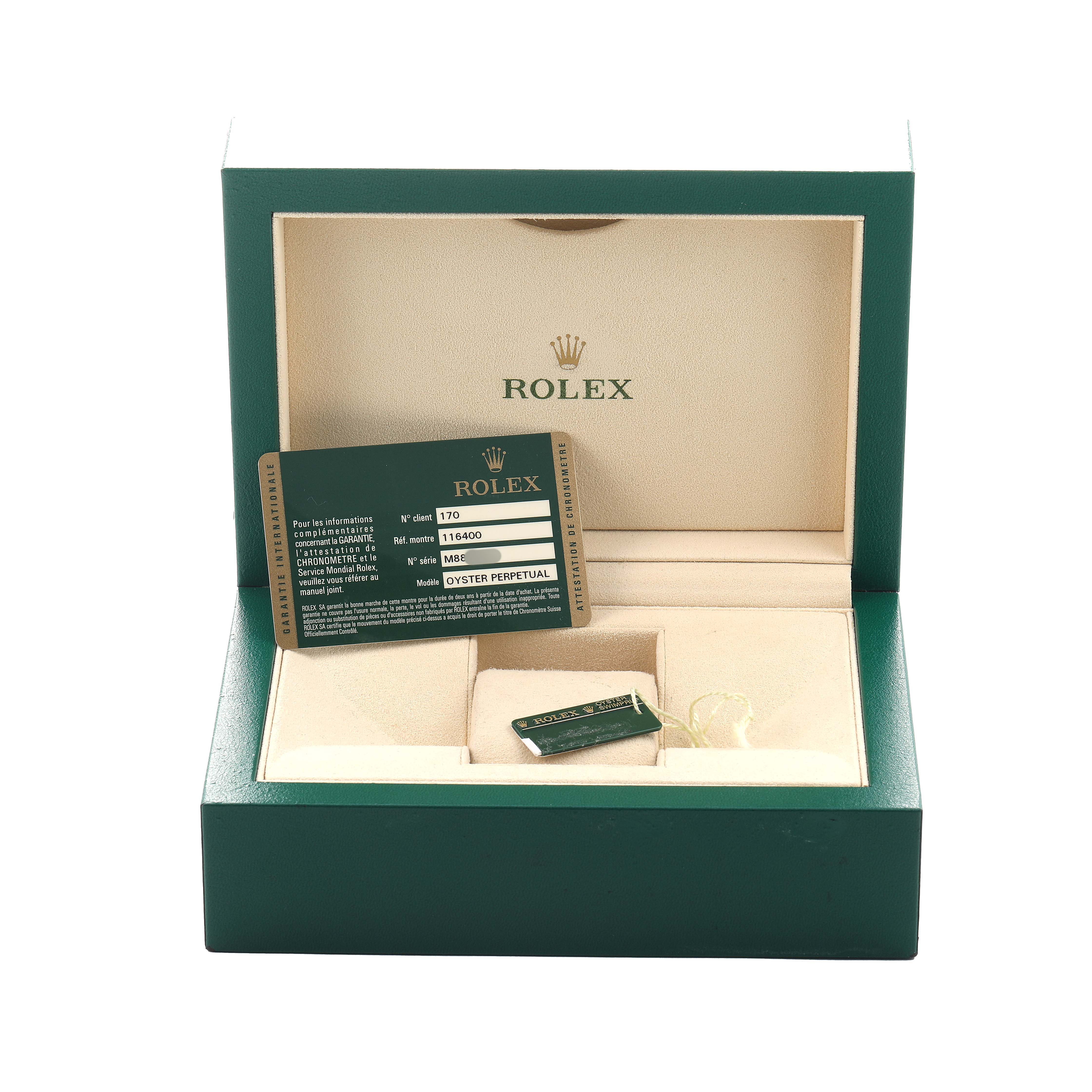 The image shows a Rolex Milgauss 116400 Men's Stainless Steel Black Dial watch box with warranty card and tags inside, viewed from the front.