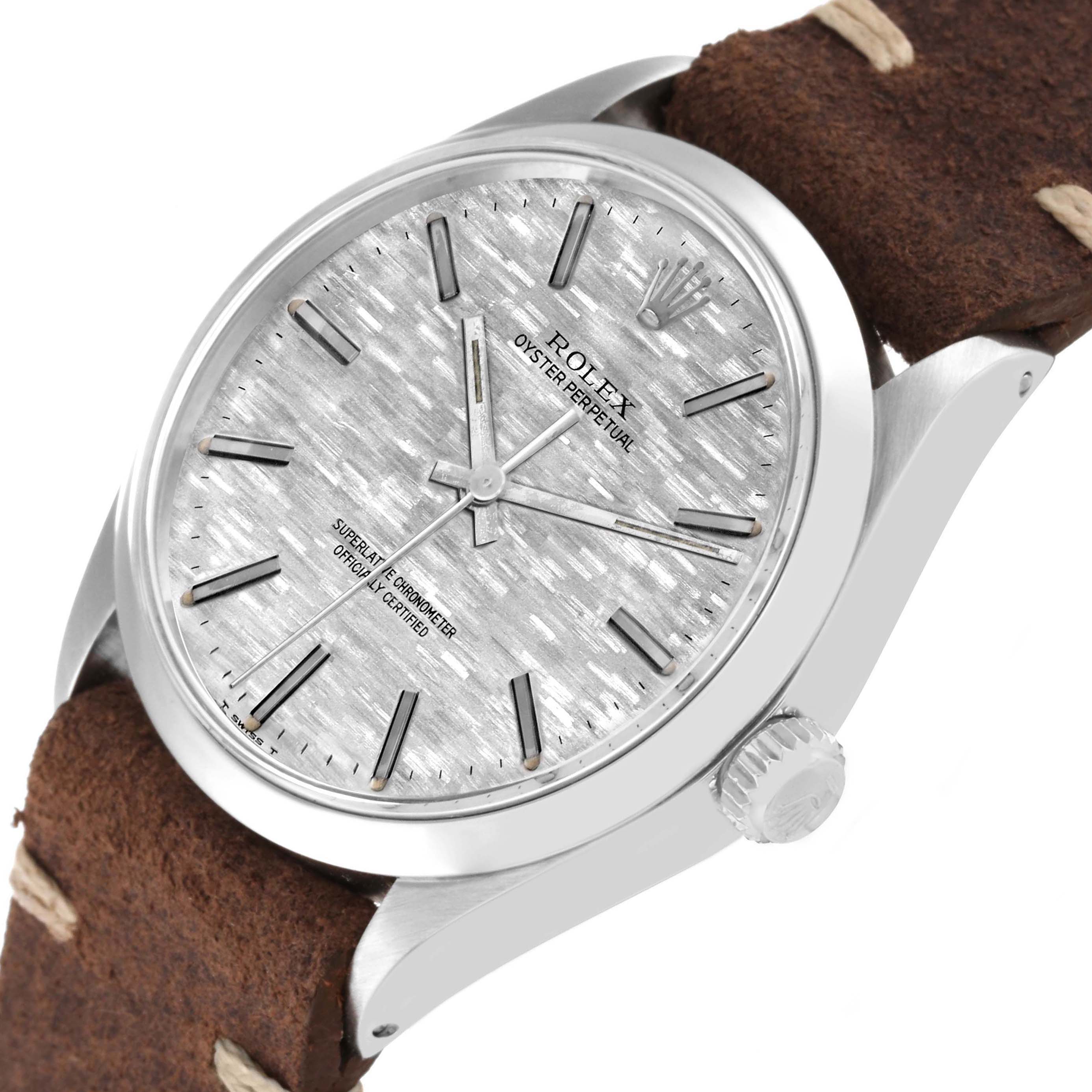 The Rolex Vintage Collection 1002 Men's Stainless Steel Silver Dial 1002 Men's Stainless Steel Silver Dial watch is shown from a slight side angle, highlighting its textured dial, crown, and leather strap.