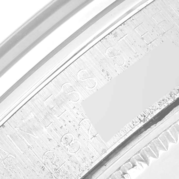 The image shows a close-up of the inner case of a Rolex Vintage Collection 1002 Men's Stainless Steel Silver Dial 1002 Men's Stainless Steel Silver Dial watch, highlighting the stainless steel inscription.