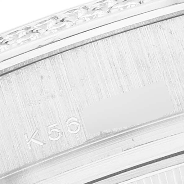 The image shows a close-up of the bracelet and case back edge of a Rolex Pearlmaster 80339 Women
s White Gold Mother of Pearl Dial, highlighting engraved markings.