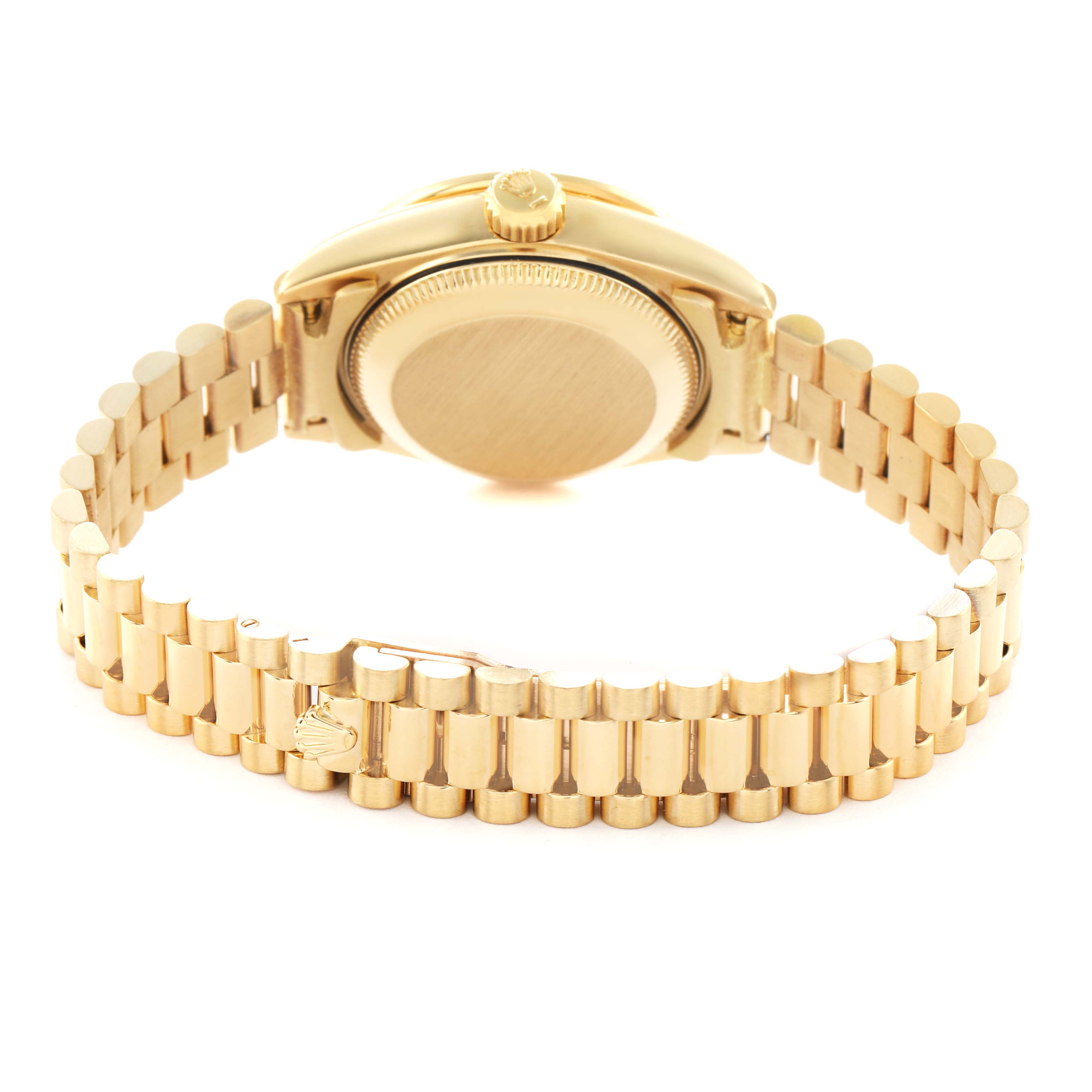 The Rolex President 69138 Women's Yellow Gold Champagne Dial model watch is shown from the back, highlighting the caseback and the signature bracelet.