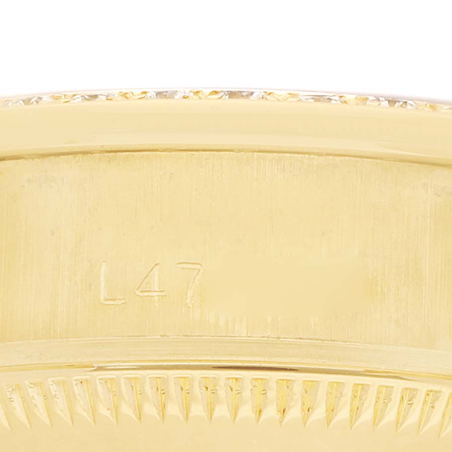 The image shows a close-up of the side of a Rolex President 69138 Women's Yellow Gold Champagne Dial watch case with the model engraving visible.